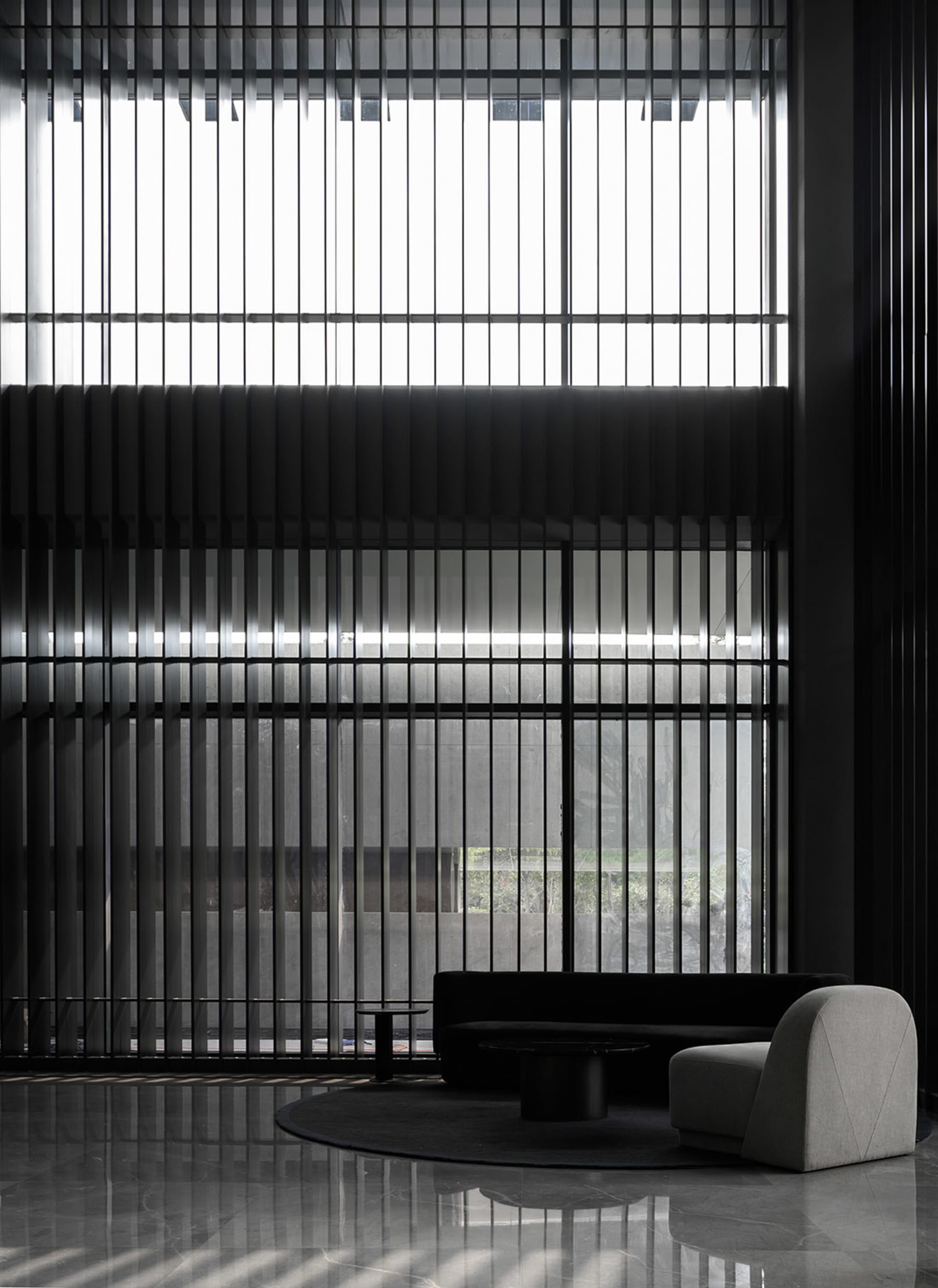 Modern lobby featuring metallic furniture and a minimalist design aesthetic.