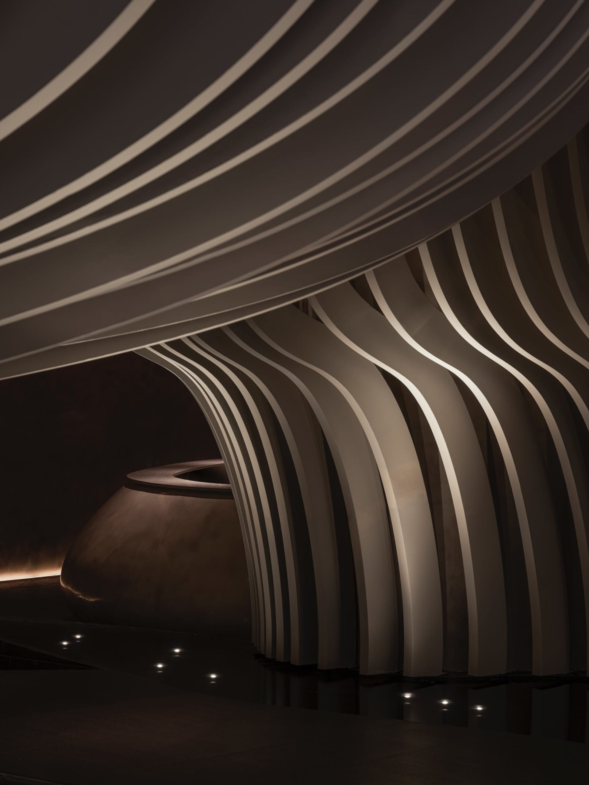 A modern interior space featuring metallic curtains