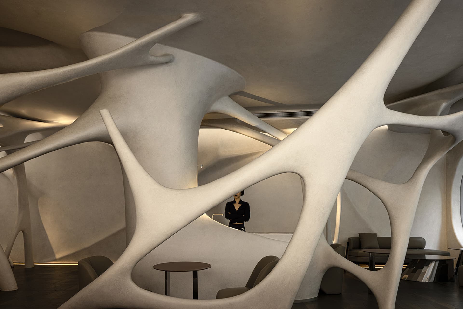 A modern interior space featuring concrete wave-like structures