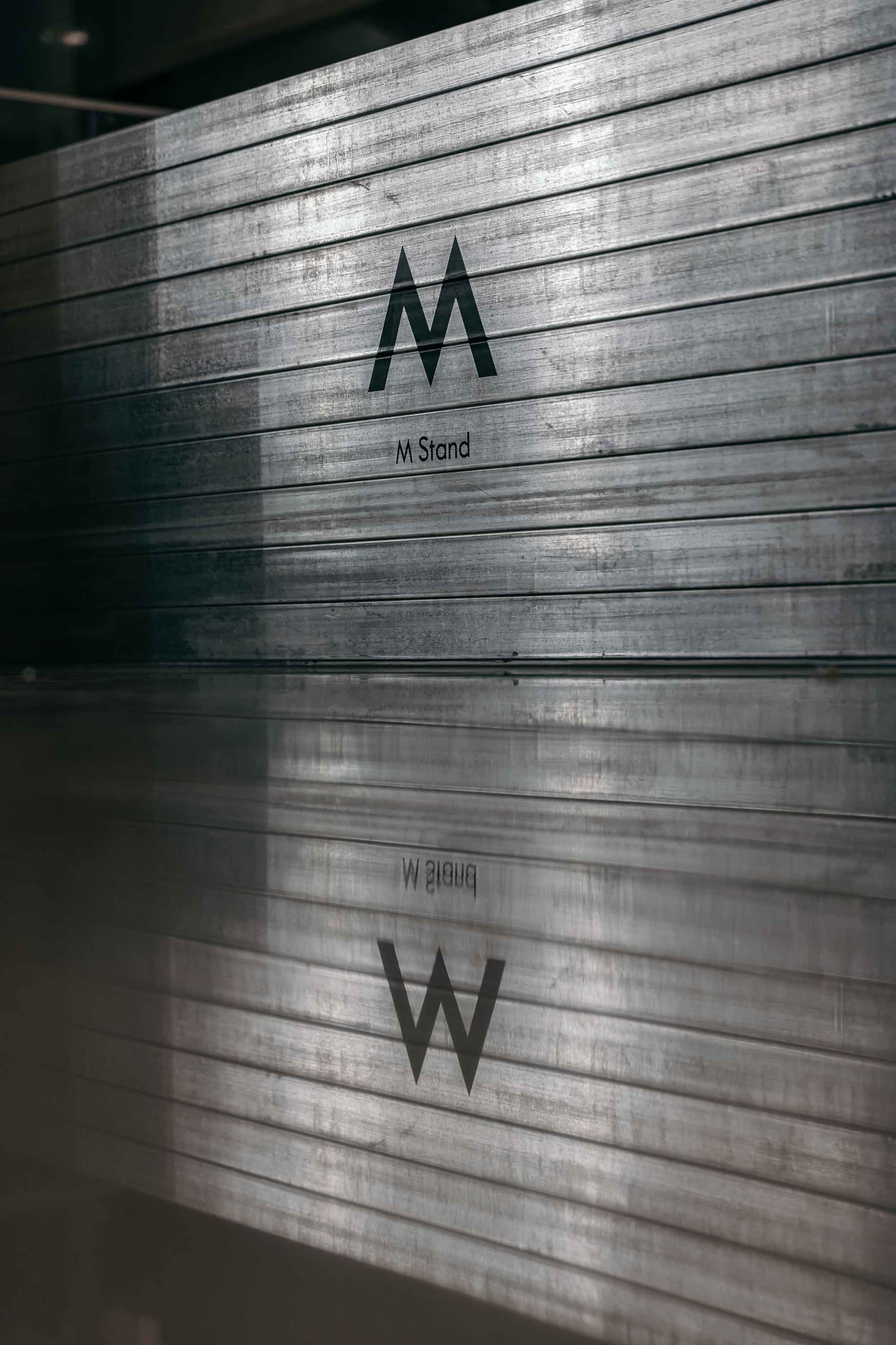 Metal storefront with the letters M and W