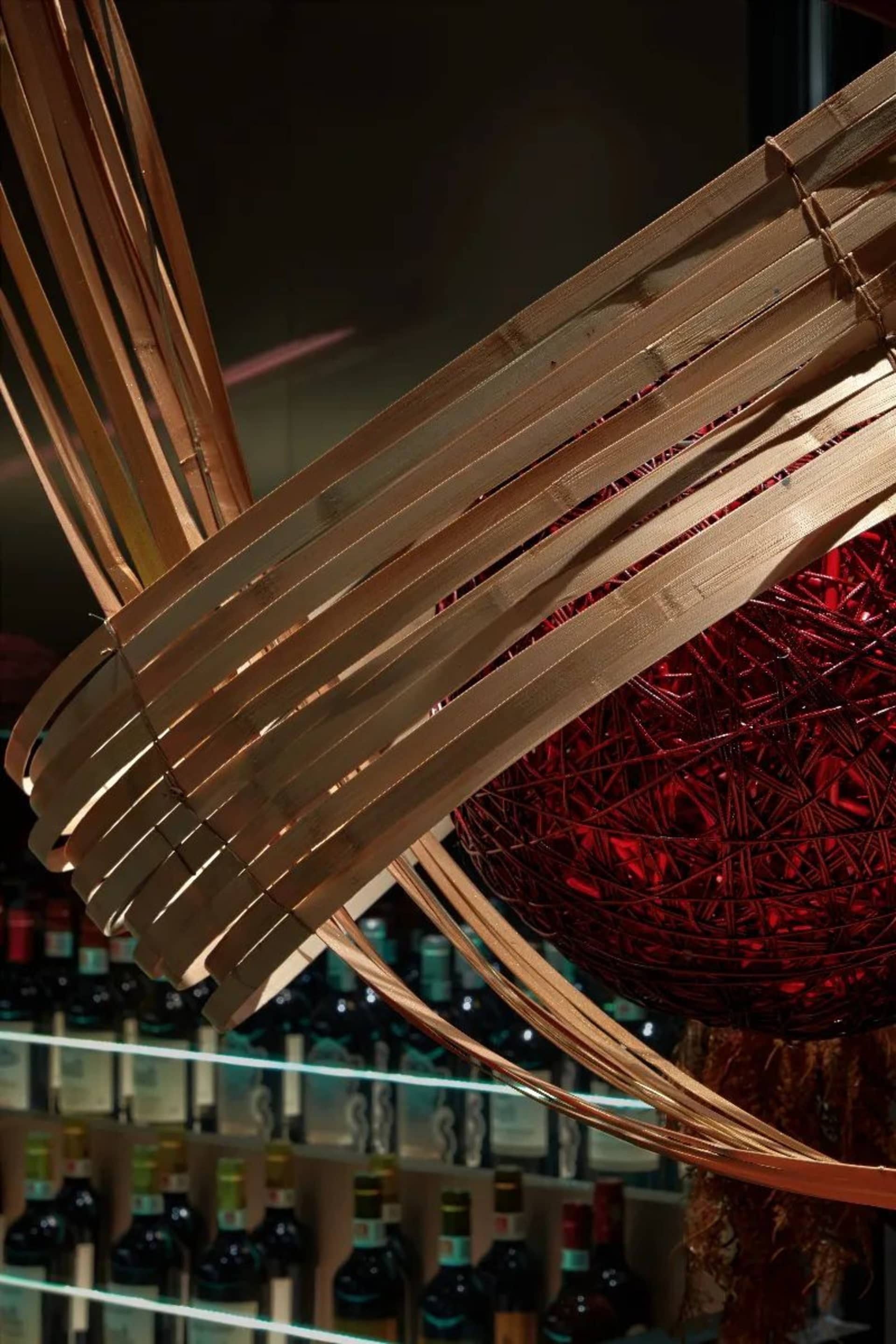 Bamboo woven lighting fixture hanging in a restaurant interior