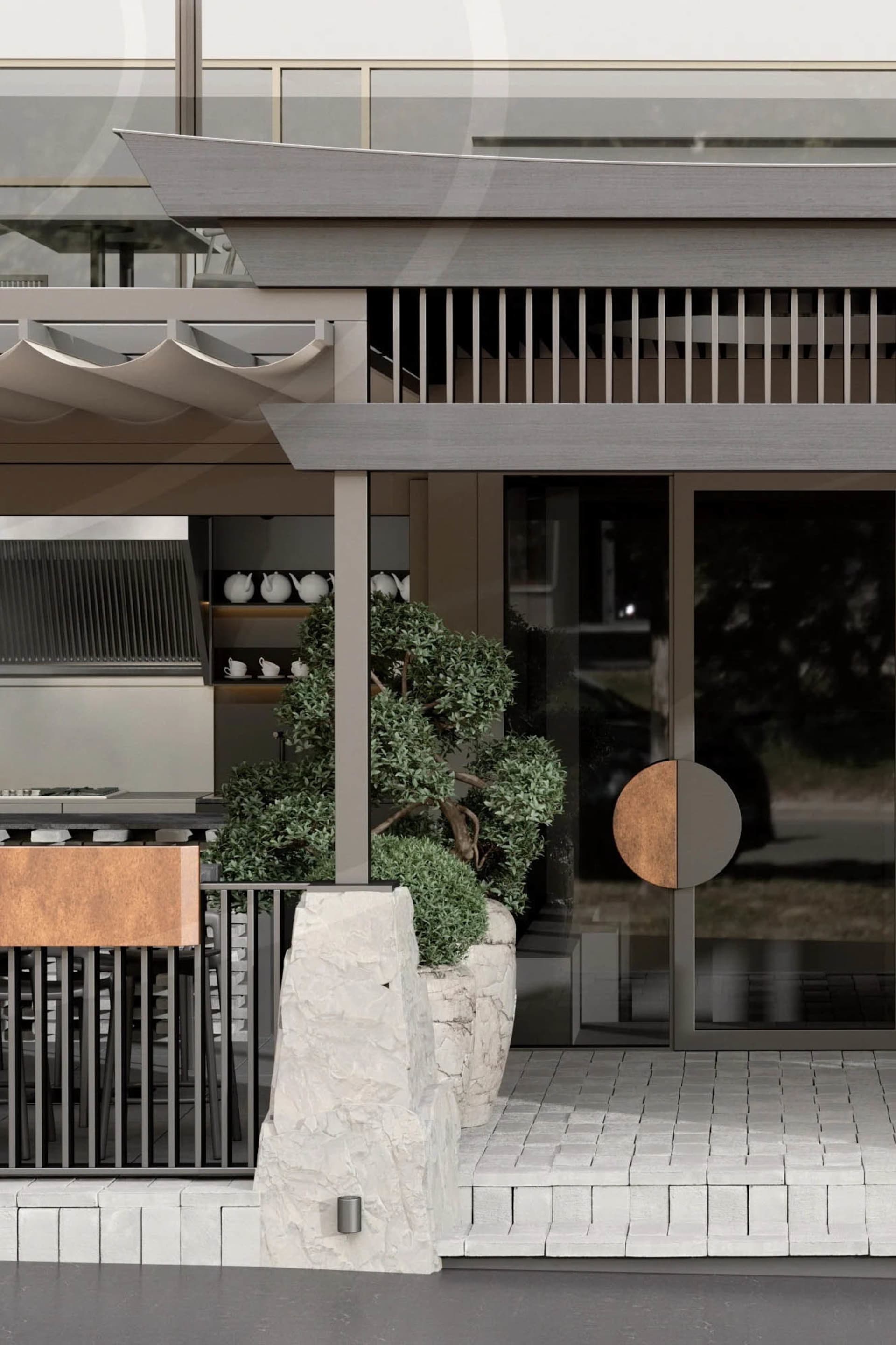 Outdoor seating area of a modern restaurant with concrete floor and glass railings.