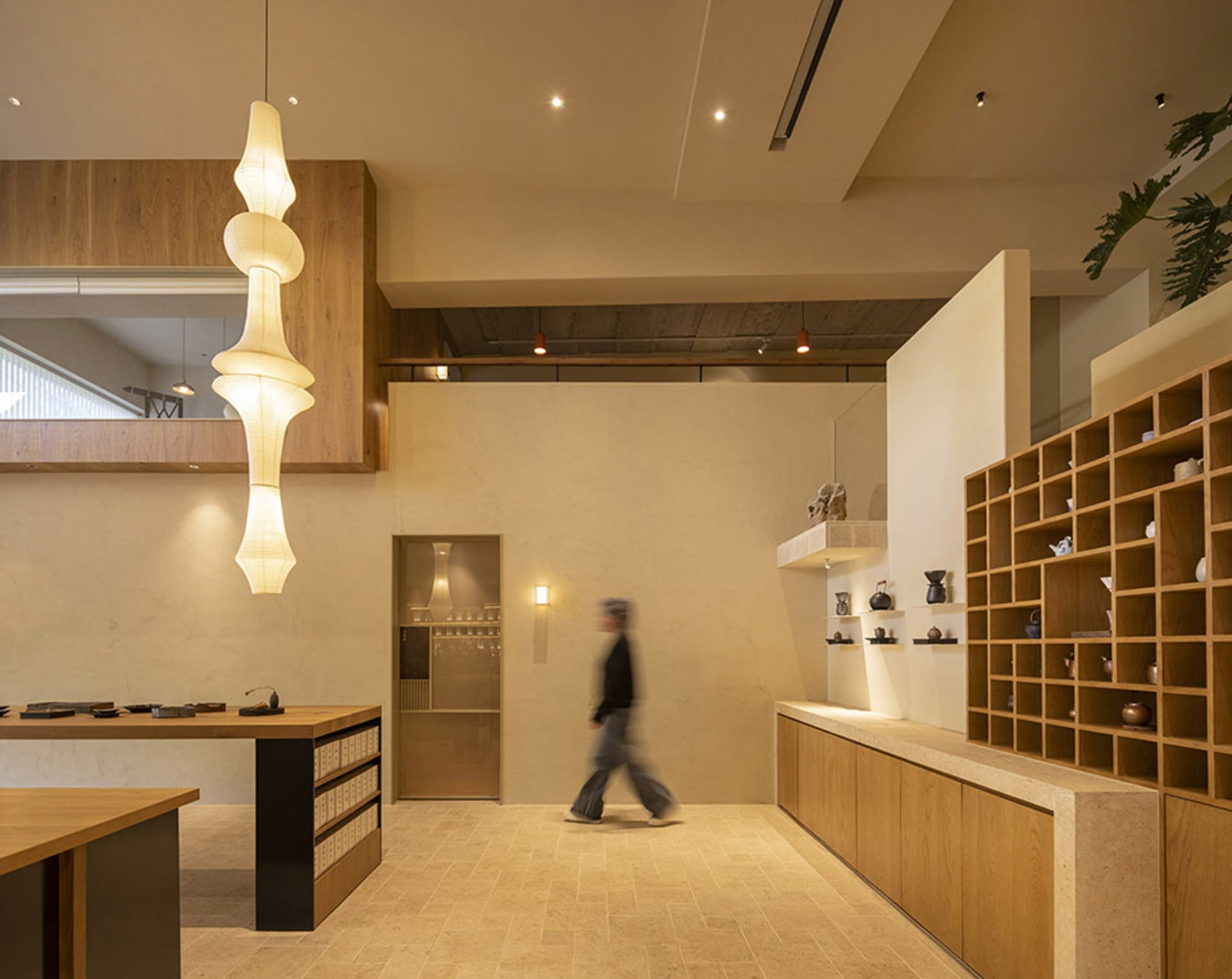 A minimalist coffee shop with wooden furniture and decor.