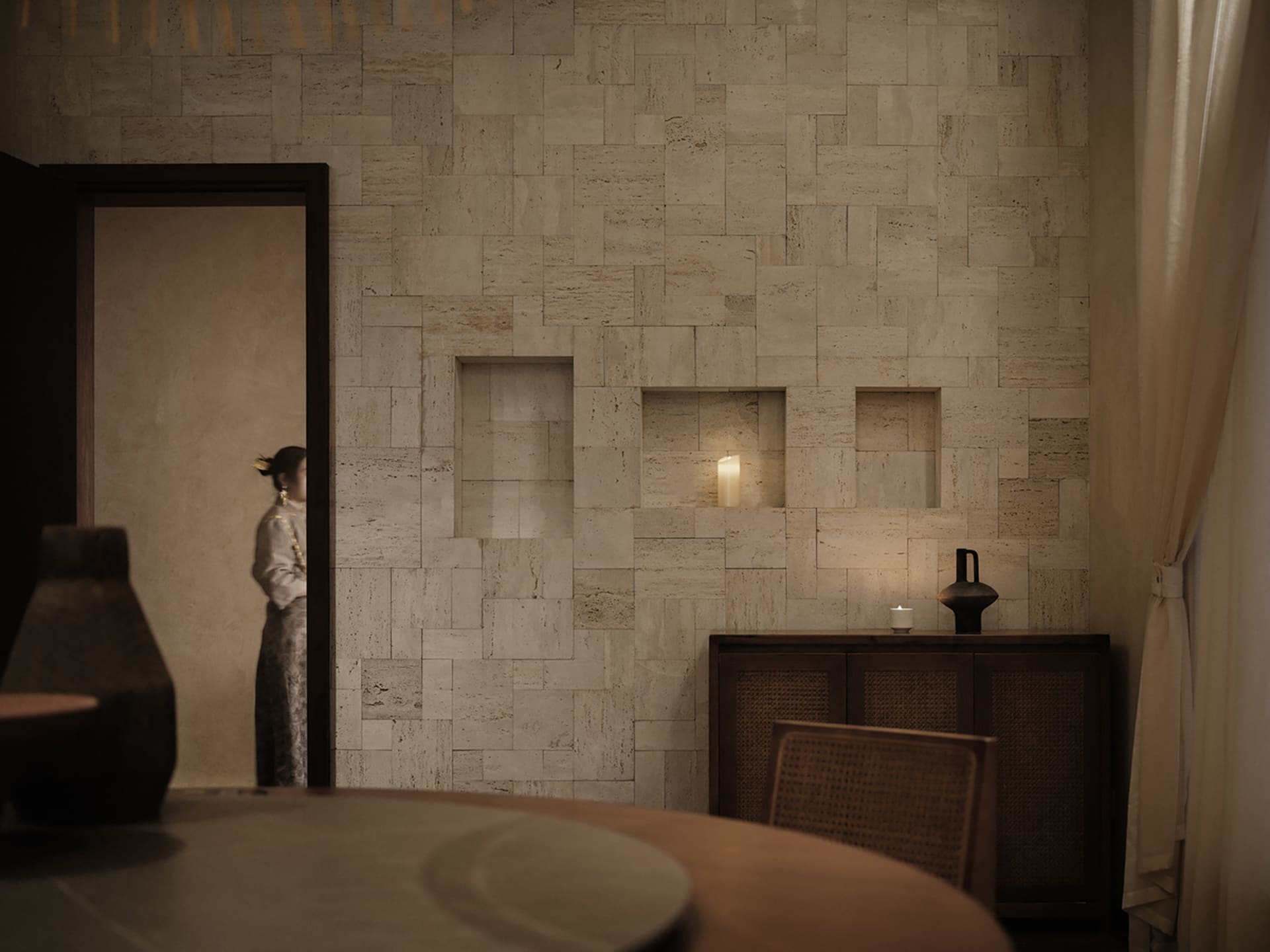 Interior design featuring stone walls with embedded lighting and a wooden cabinet with candles.