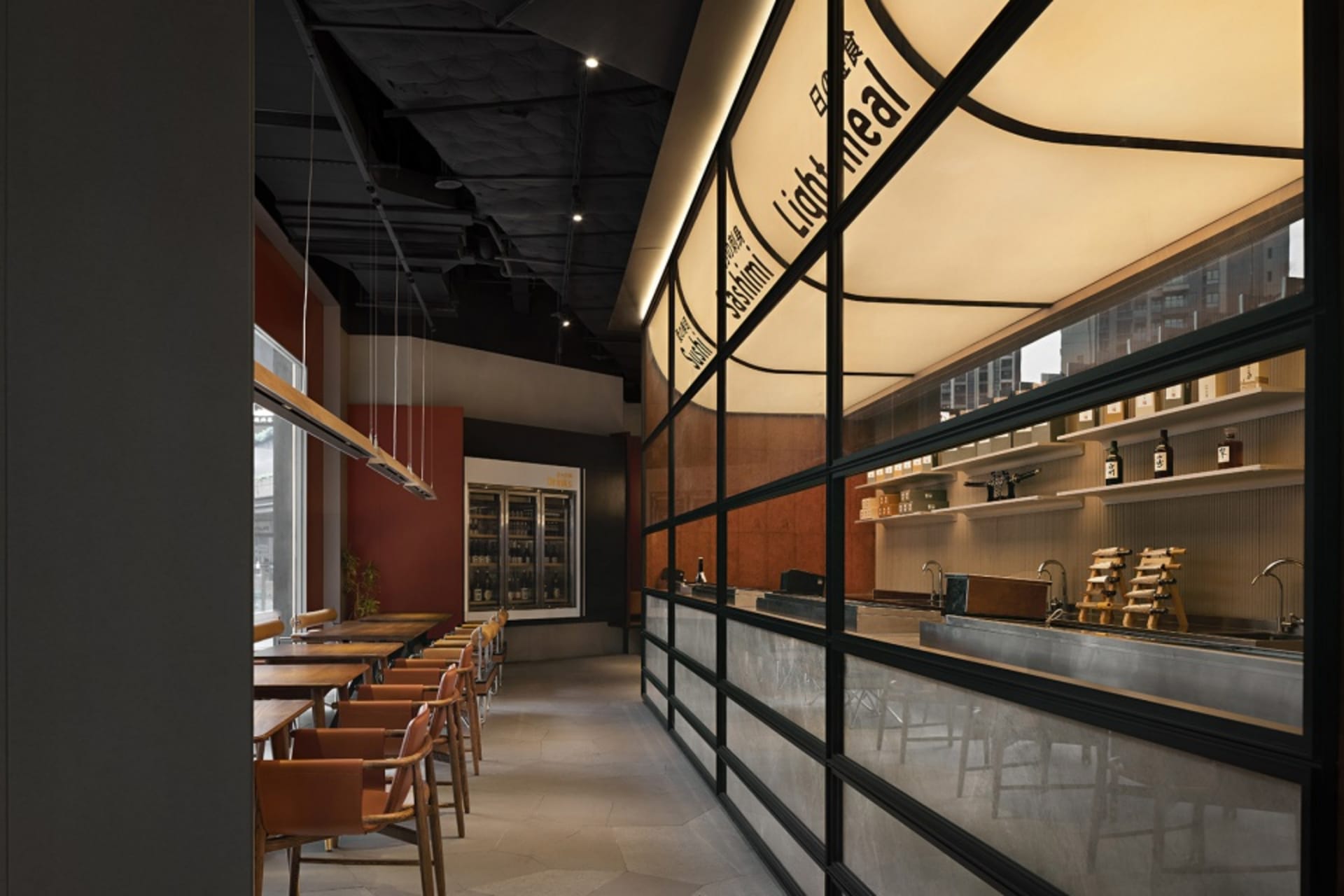 Modern restaurant interior with glass cabinets and warm lighting.