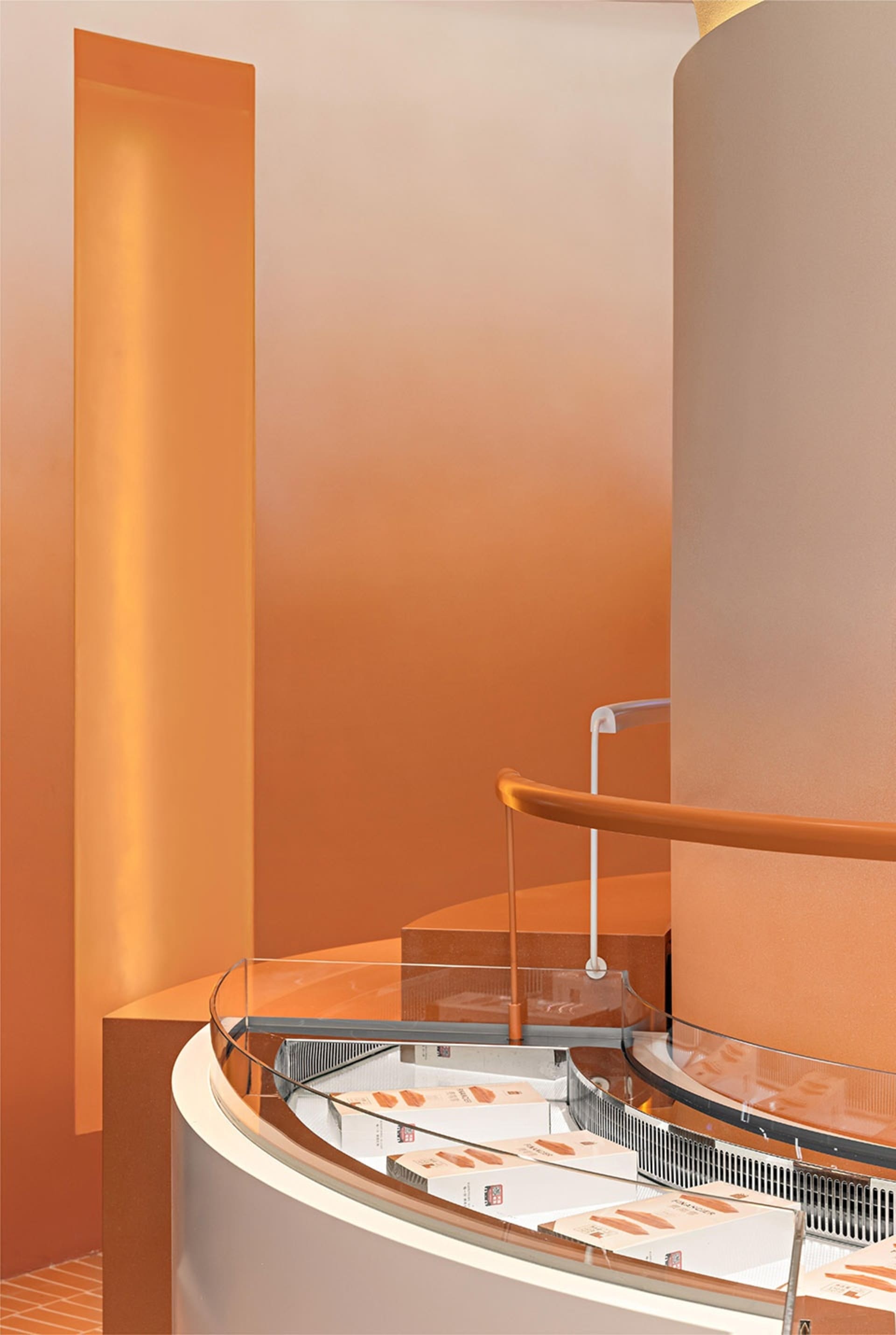 An industrial-style retail interior featuring modern metal, glass, and concrete materials.