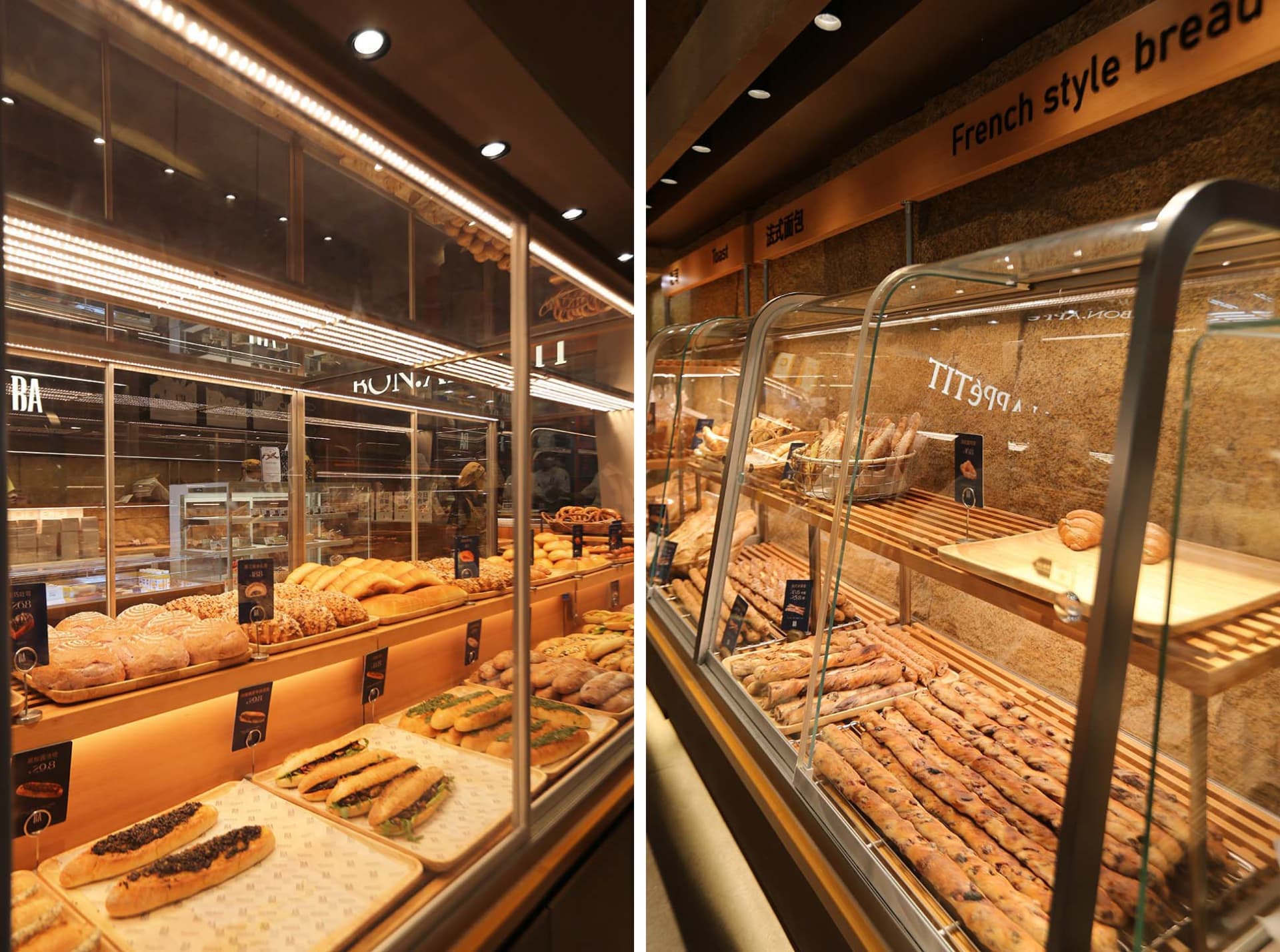 A modern bakery shop showcasing an array of freshly baked breads and pastries in a glass display case.