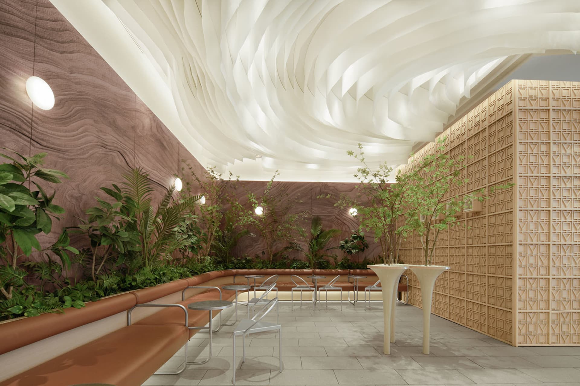 Modern restaurant interior with wooden walls, concrete flooring, and greenery