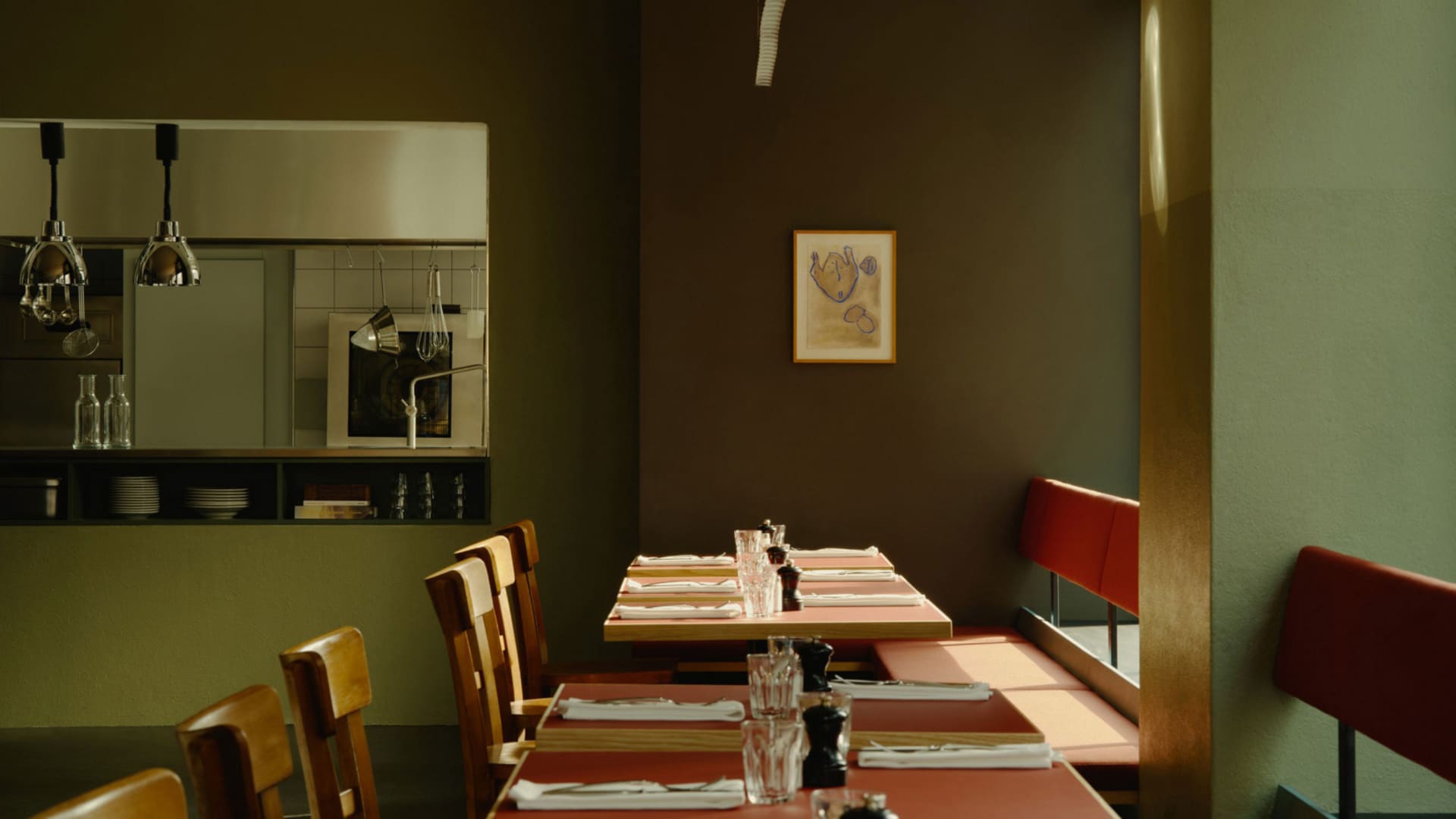 A modern restaurant interior with wooden tables and chairs