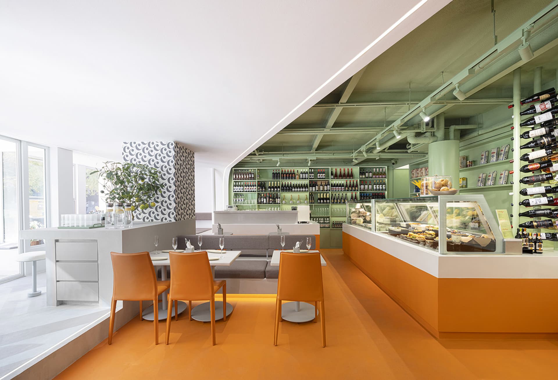 An open-concept restaurant featuring modern design elements such as metal, wood, and glass.