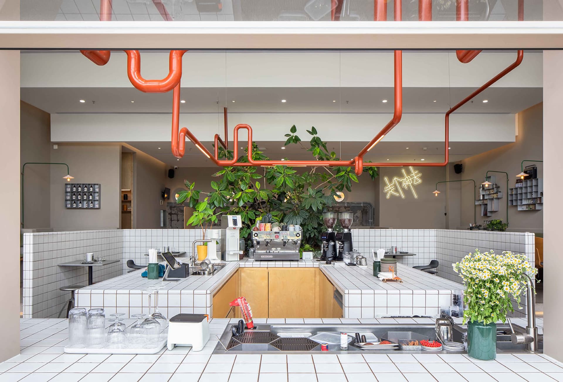 Industrial design cafe interior featuring a tiled and concrete floor