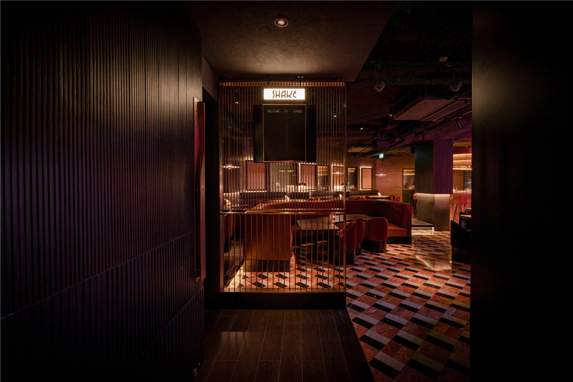 Industrial-style restaurant interior with metal ceiling and modern seating areas