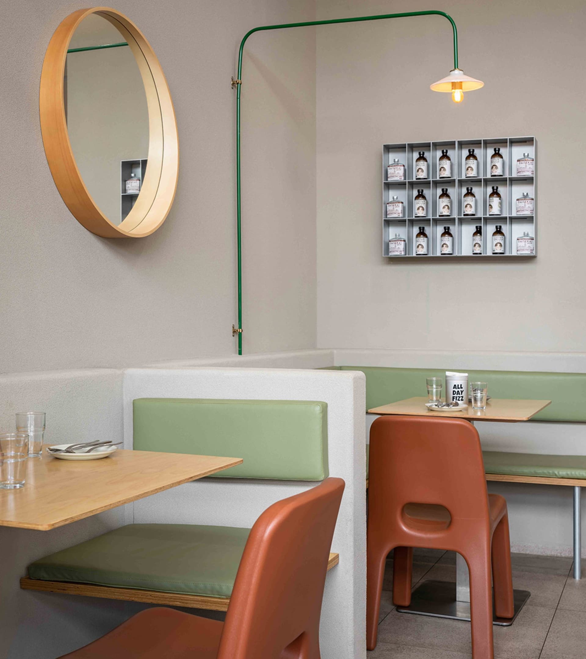 Minimalist restaurant interior with modern furniture and materials.