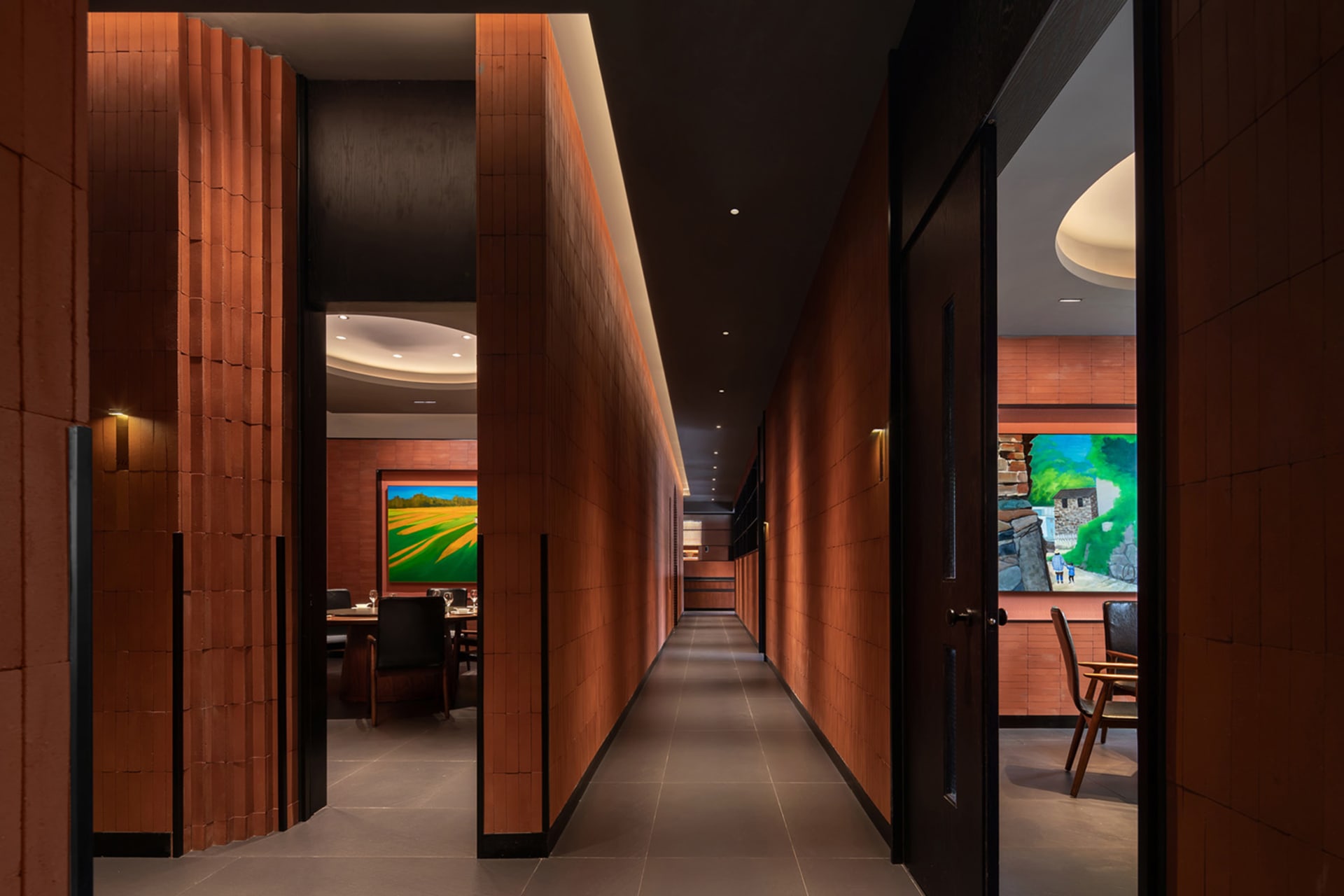 A minimalist hallway with tiled walls and wooden fixtures.