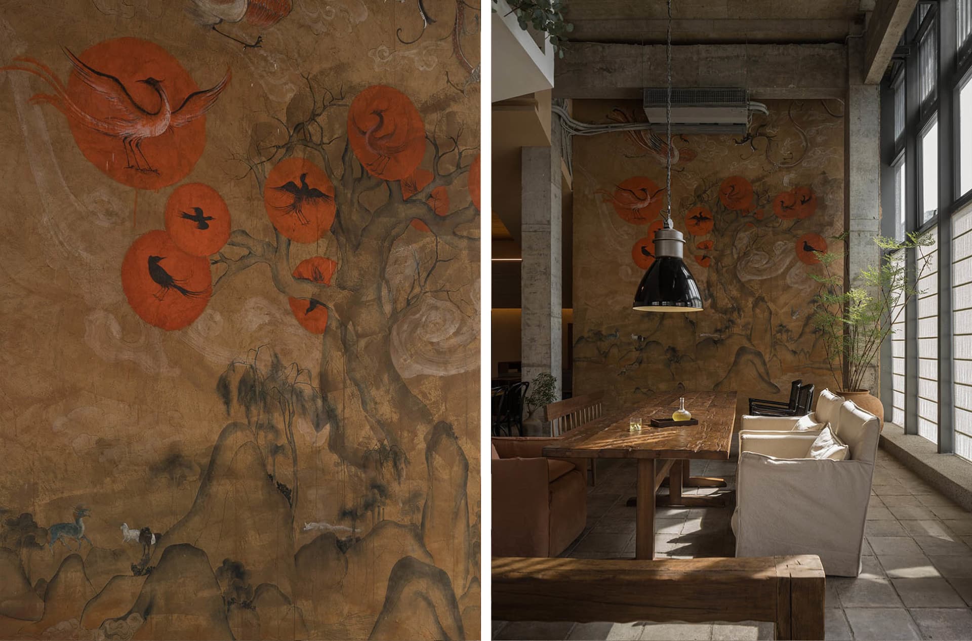 A modern restaurant interior featuring a wall art with floating orange circles and wooden furniture.