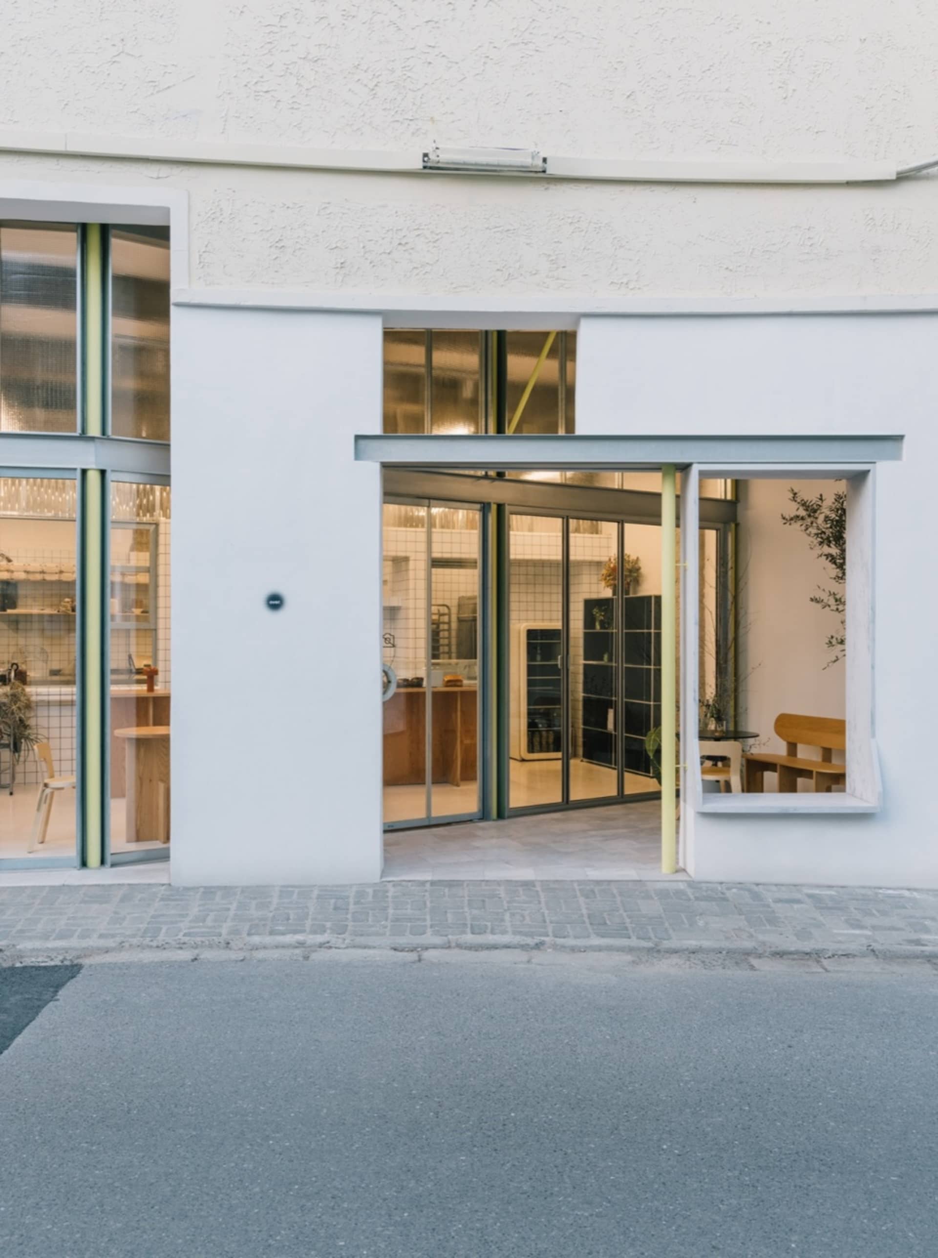 A modern retail storefront with large glass windows and a sleek, minimalist design.