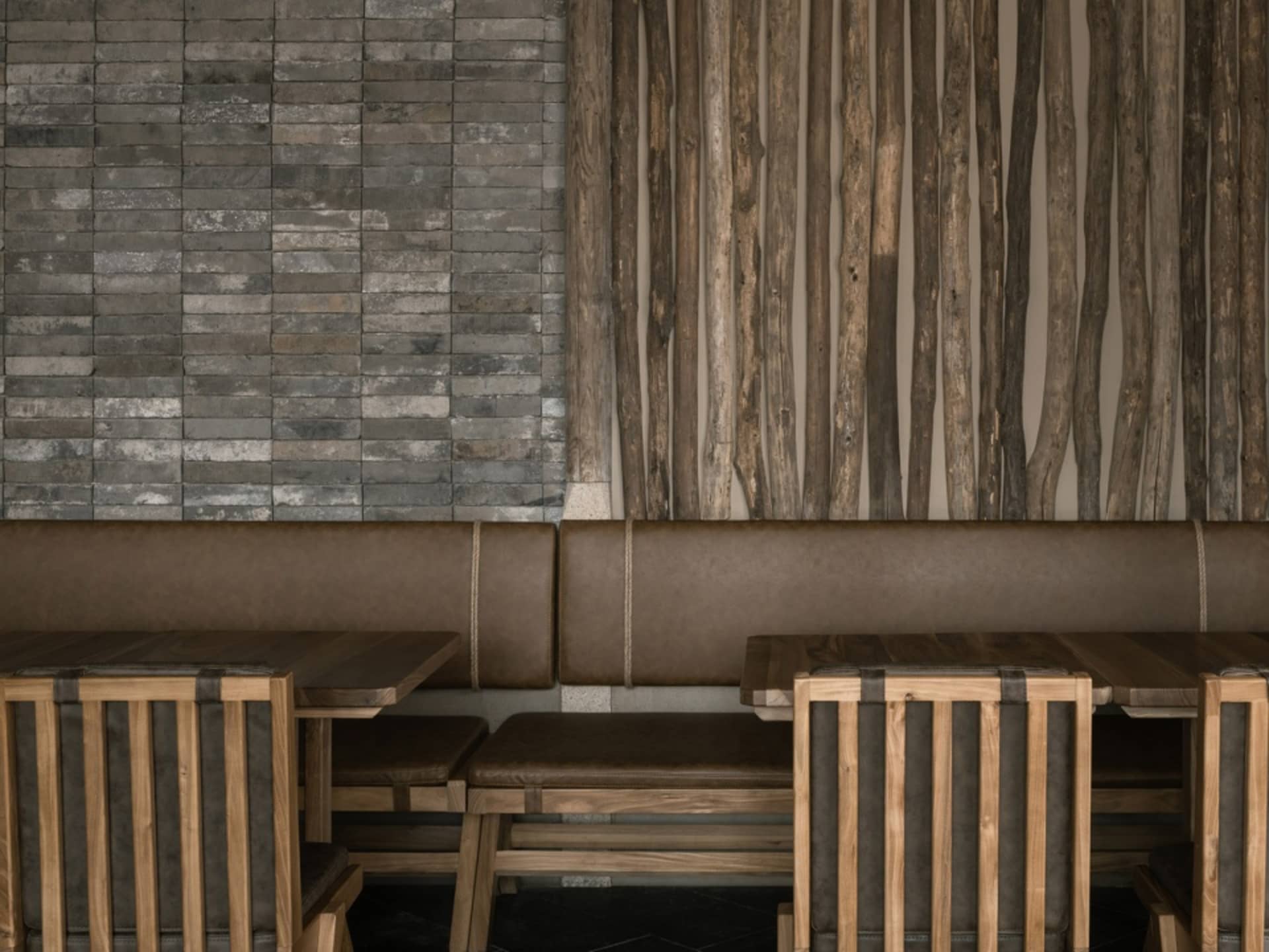Industrial-style restaurant interior with wooden furniture and leather seating.