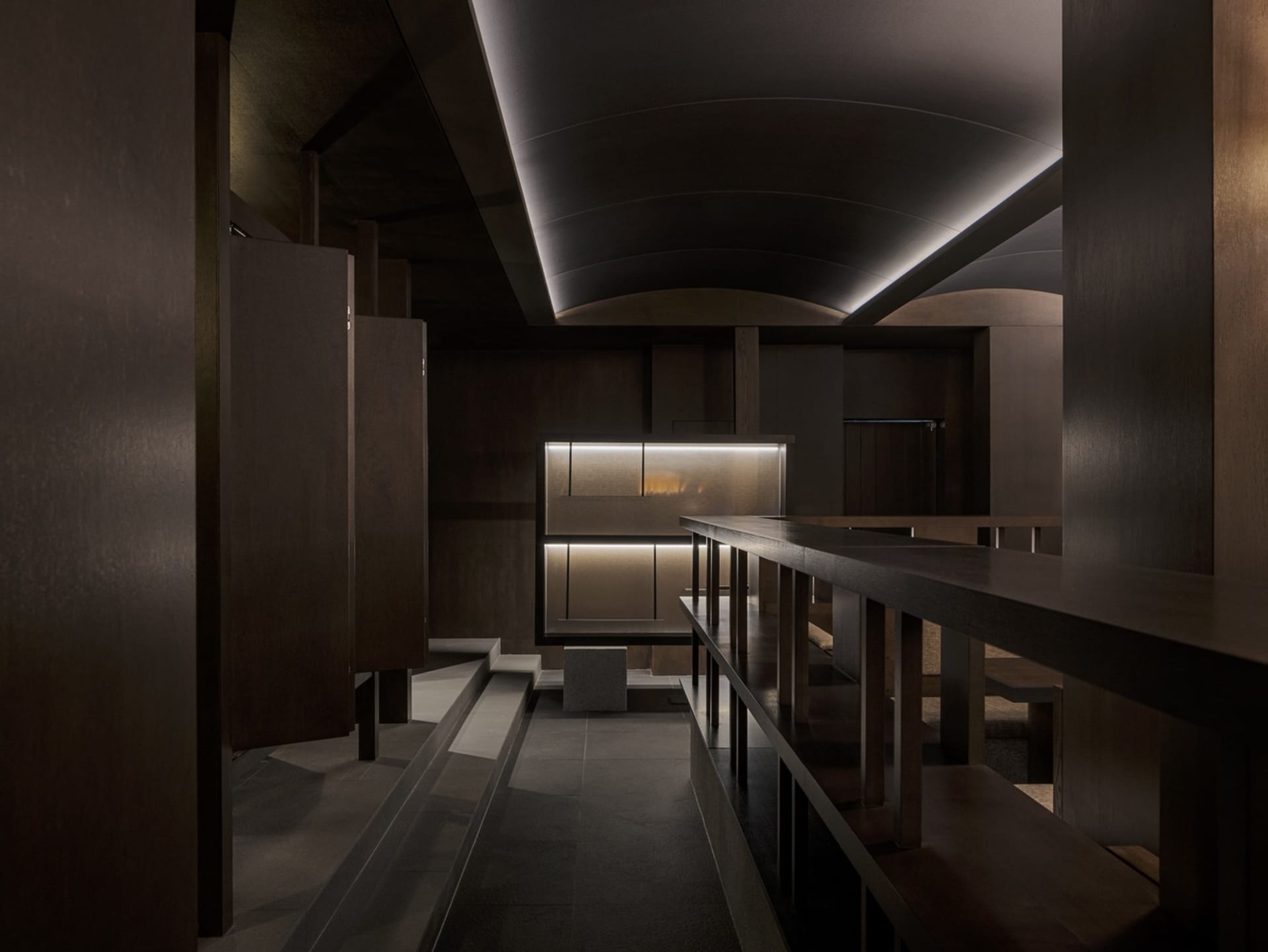 A modern restaurant interior featuring wooden elements and contemporary design.