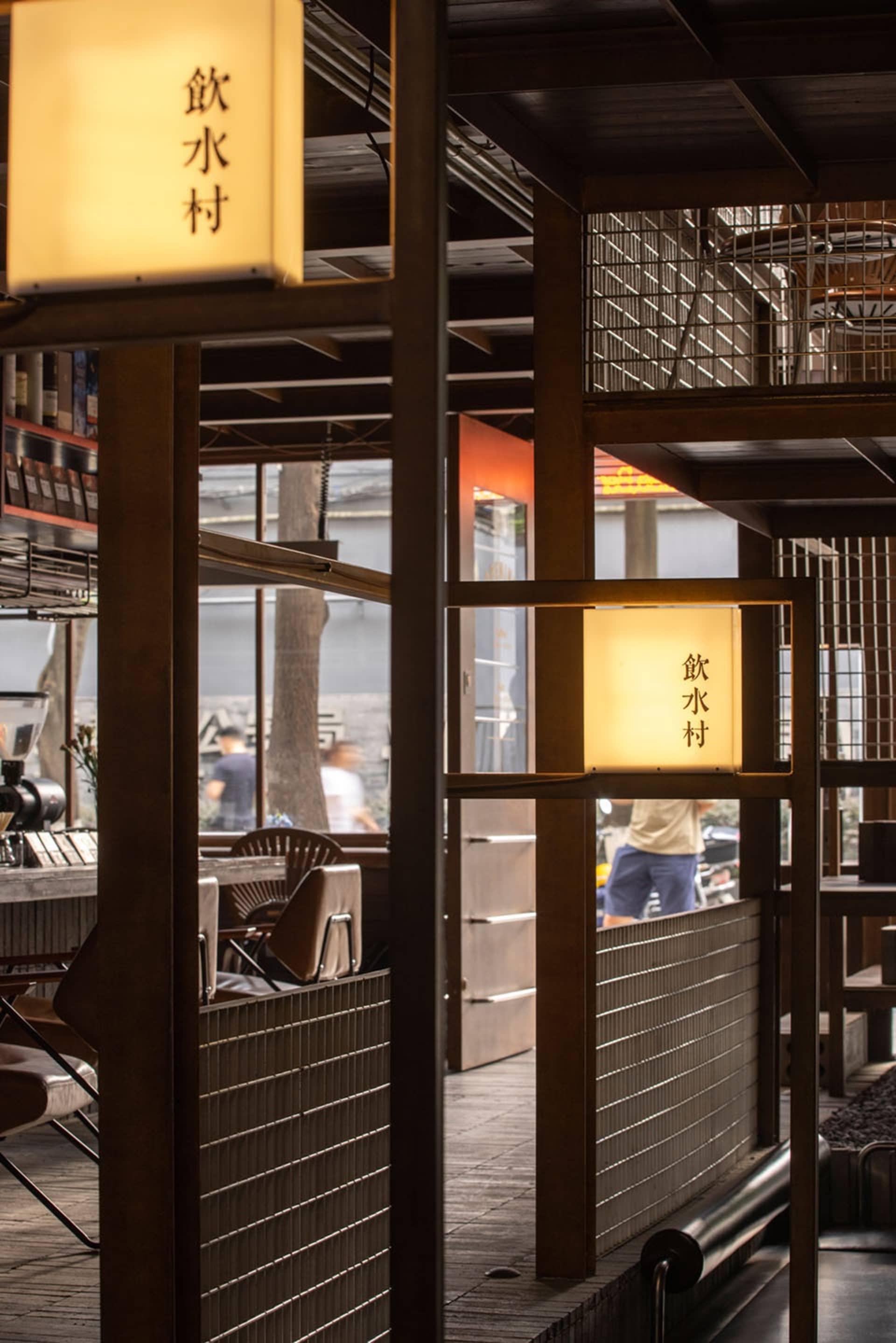 Industrial-themed restaurant interior with wooden walls and lighting fixtures