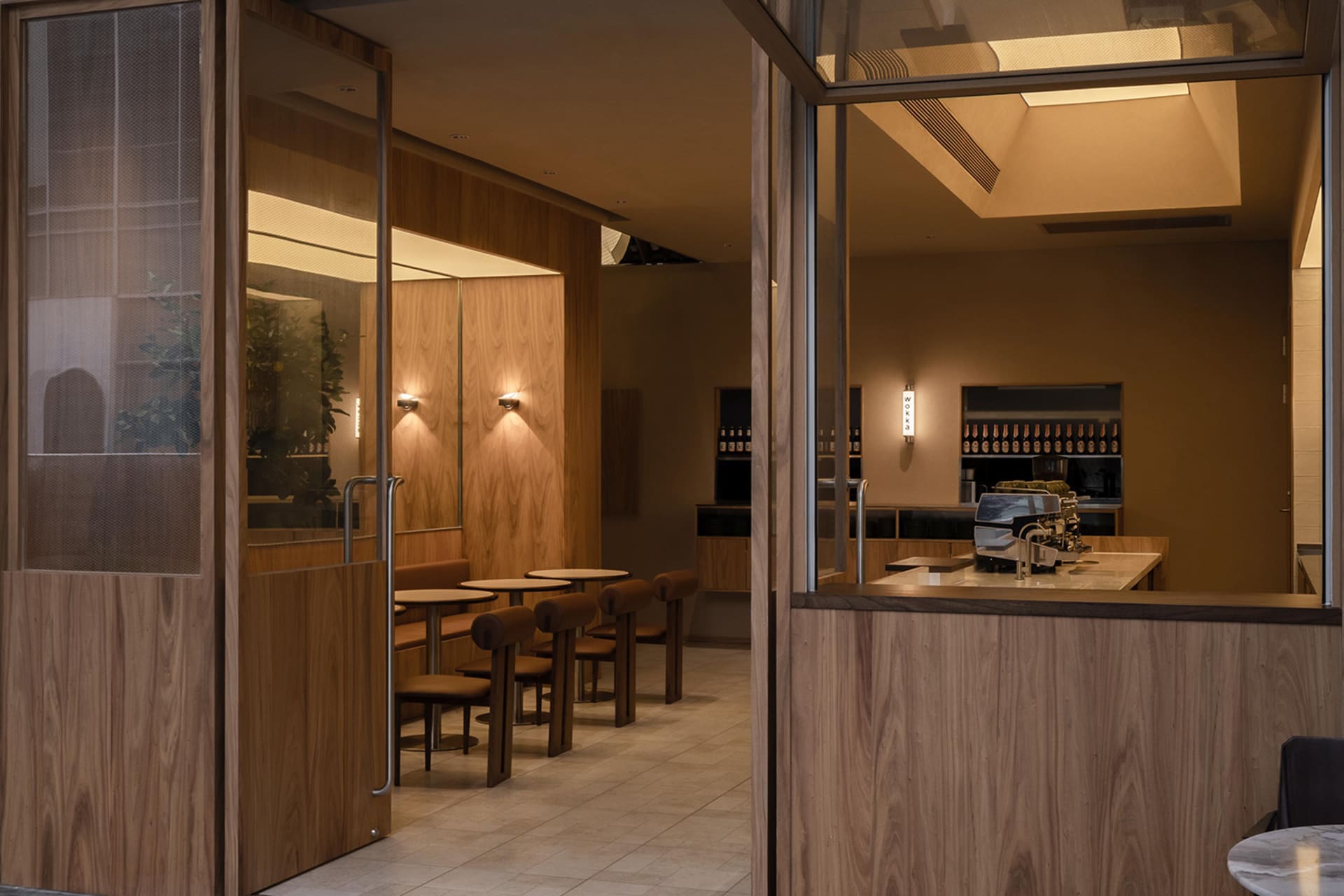 Interior of a modern restaurant with wooden accents and seating arrangements.