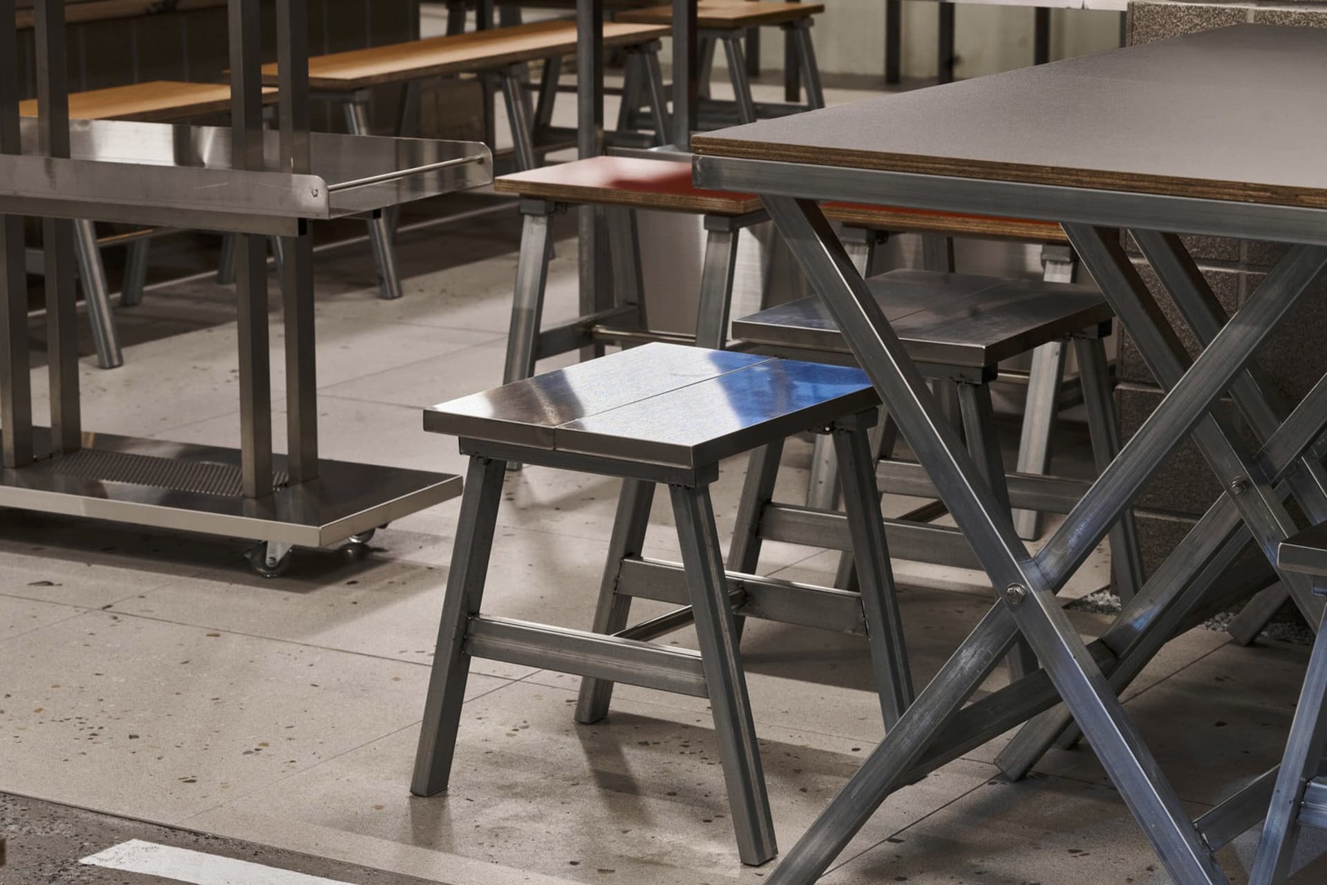 Industrial-style metal stools and tables