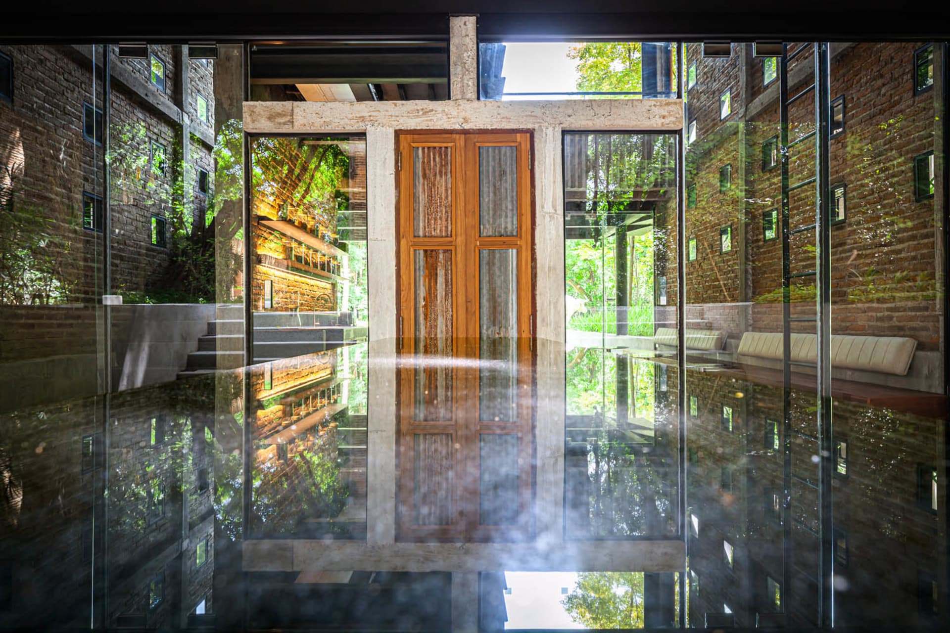 Modern lobby entrance with glass door and reflection