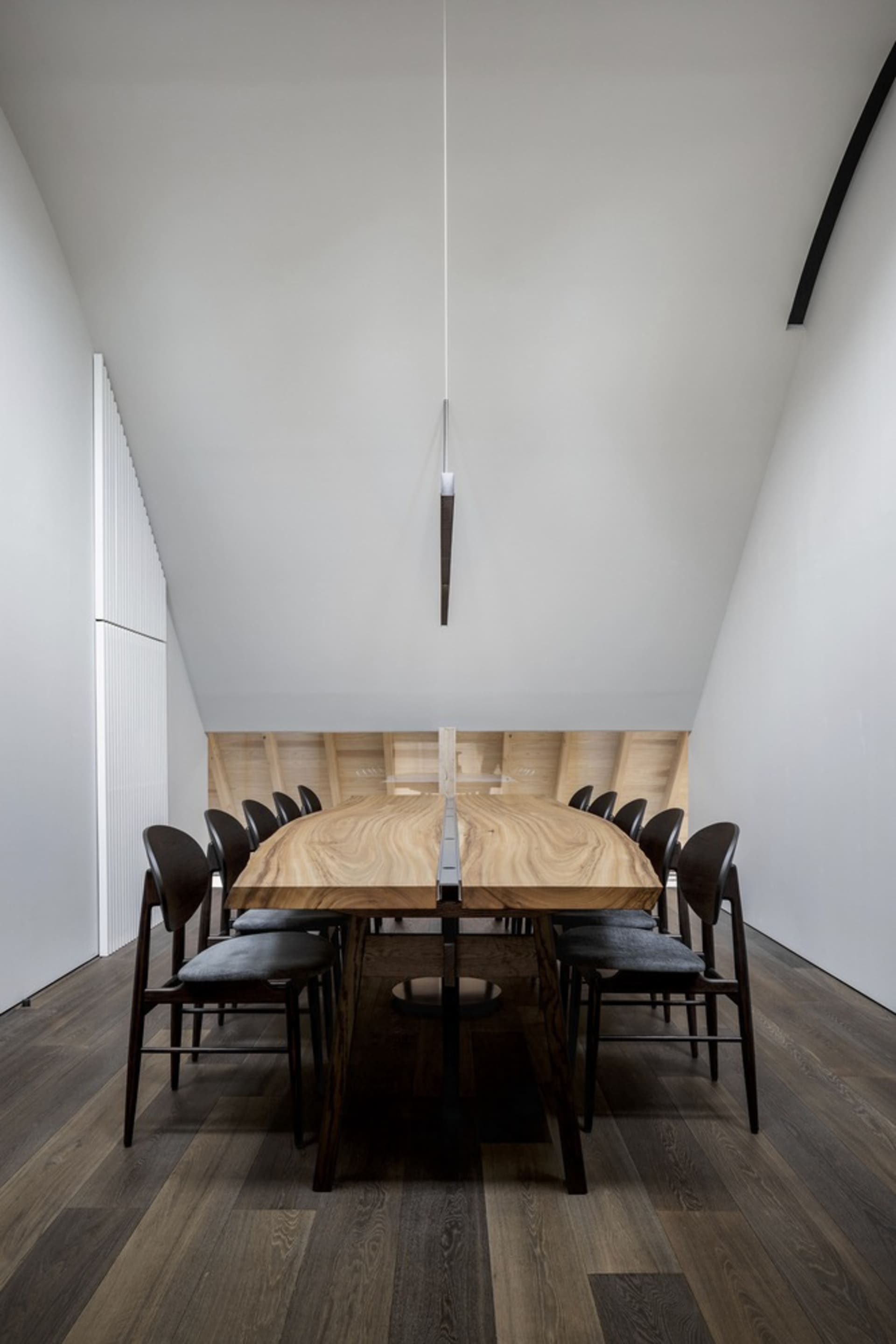 Interior of a modern conference room featuring a wooden conference table.