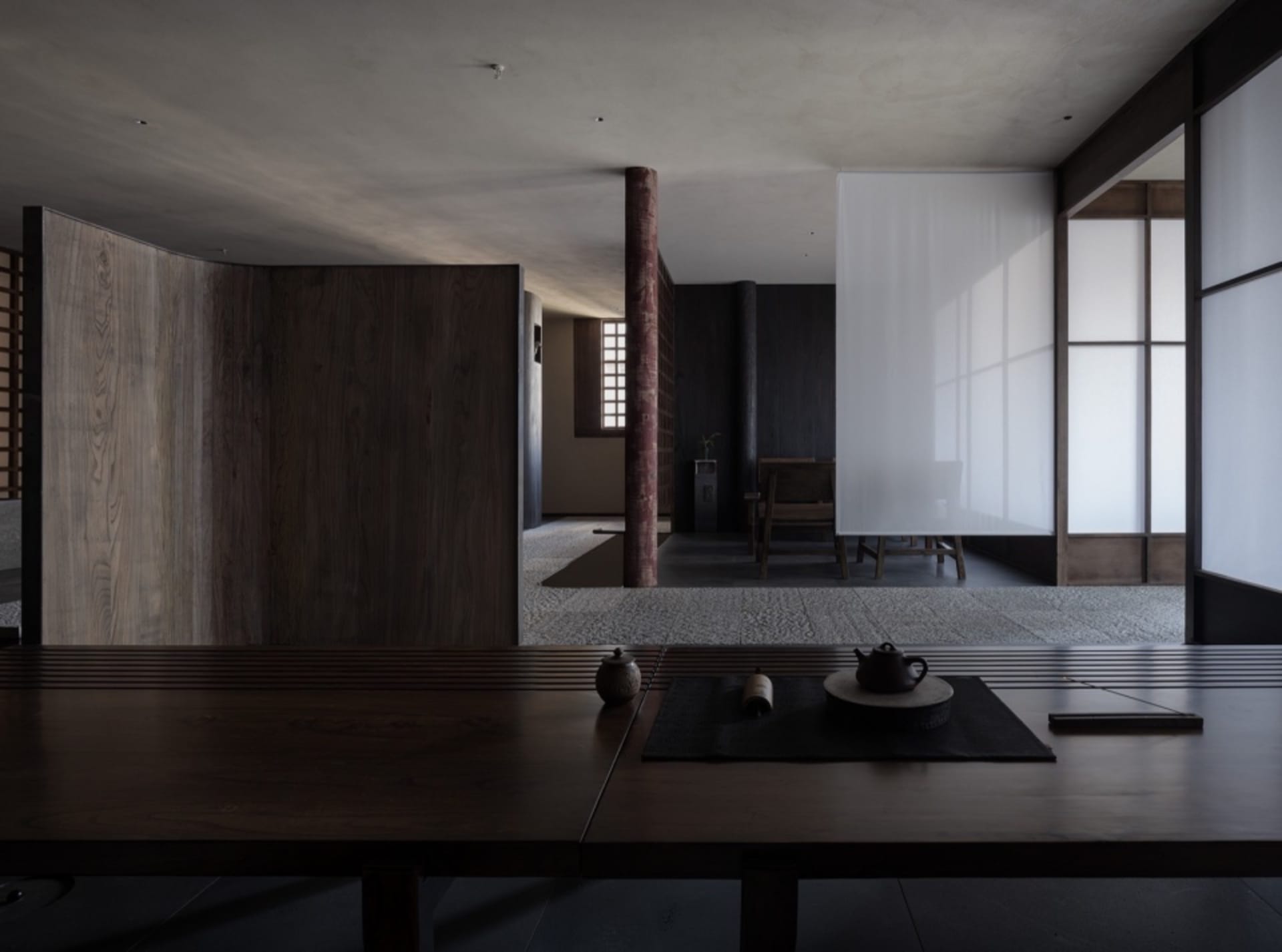 A modern interior design featuring wooden tables and chairs.