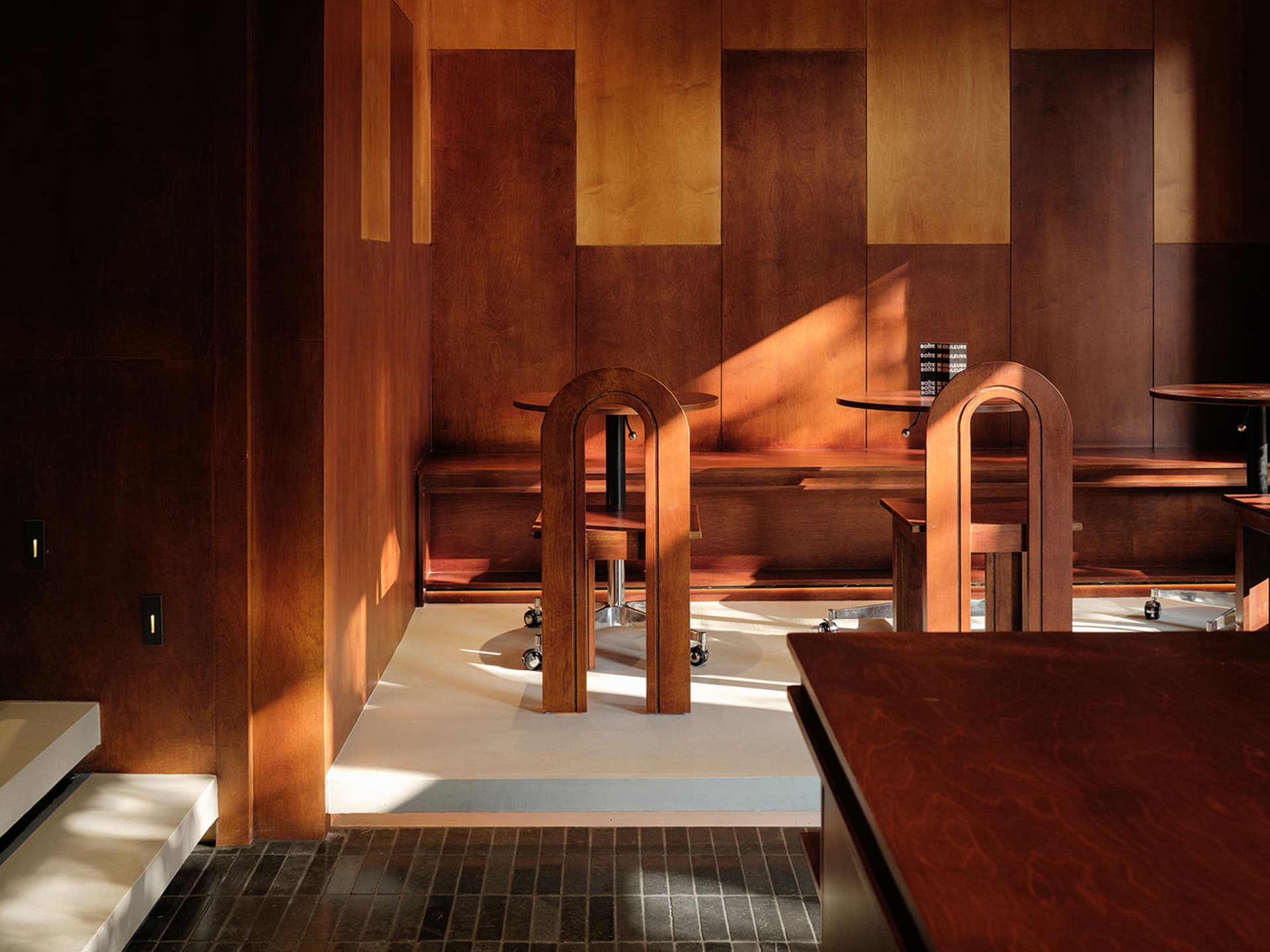 Modern restaurant interior with wooden walls and furniture