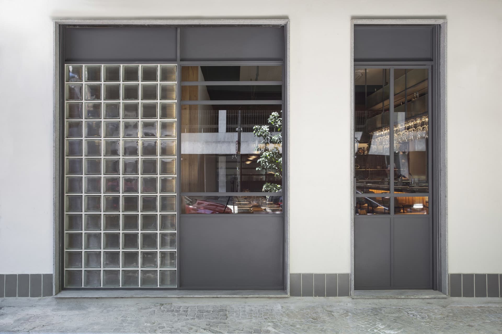 The storefront features a modern glass design.