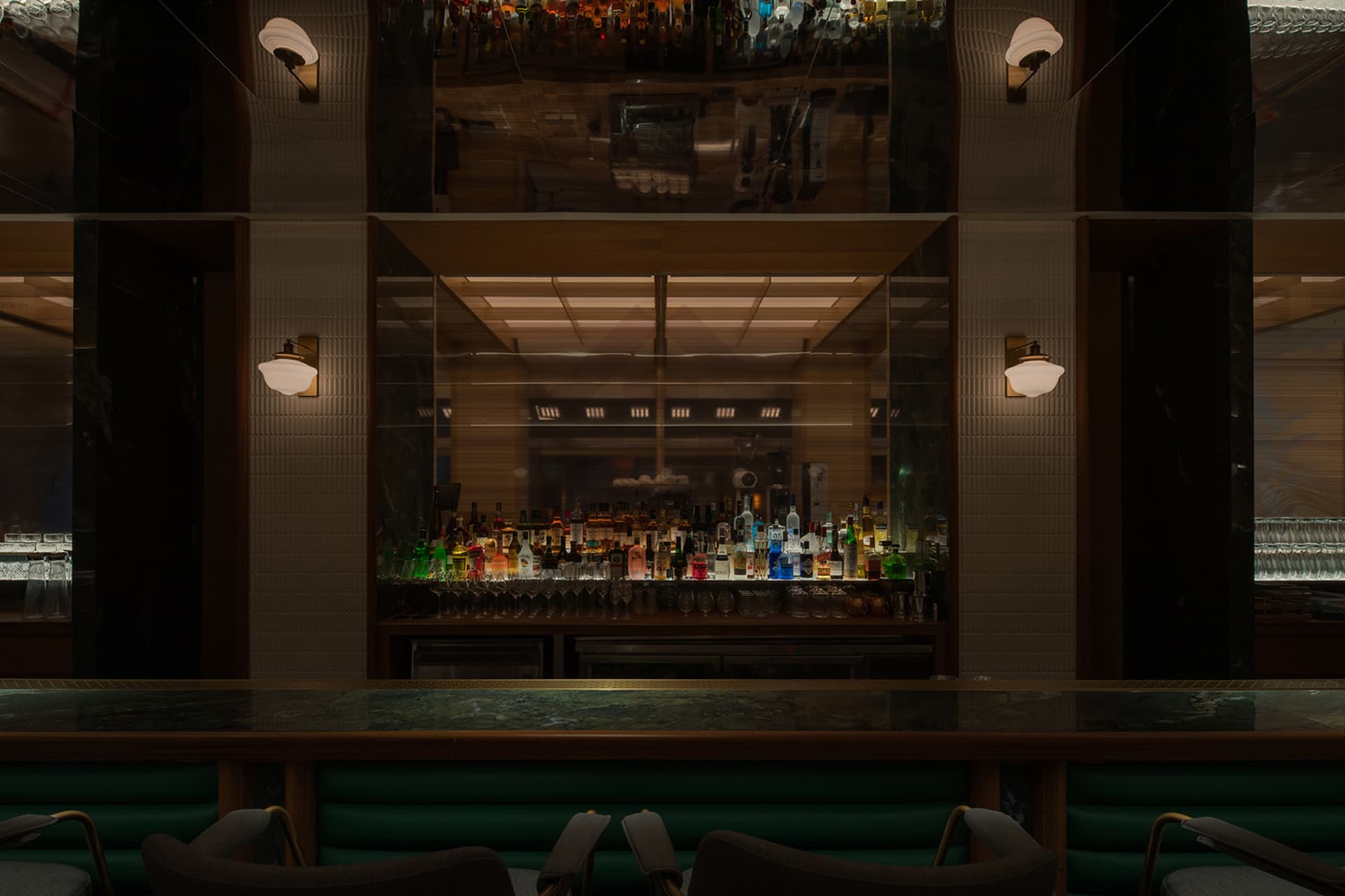 A sleek, modern bar counter with a marble top.