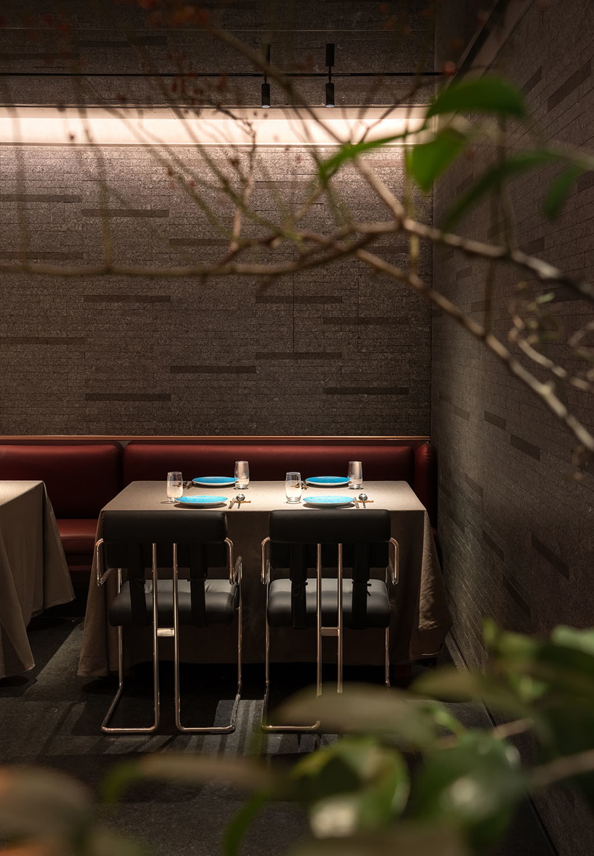 Industrial-themed restaurant with brick walls and metal furniture and fixtures.