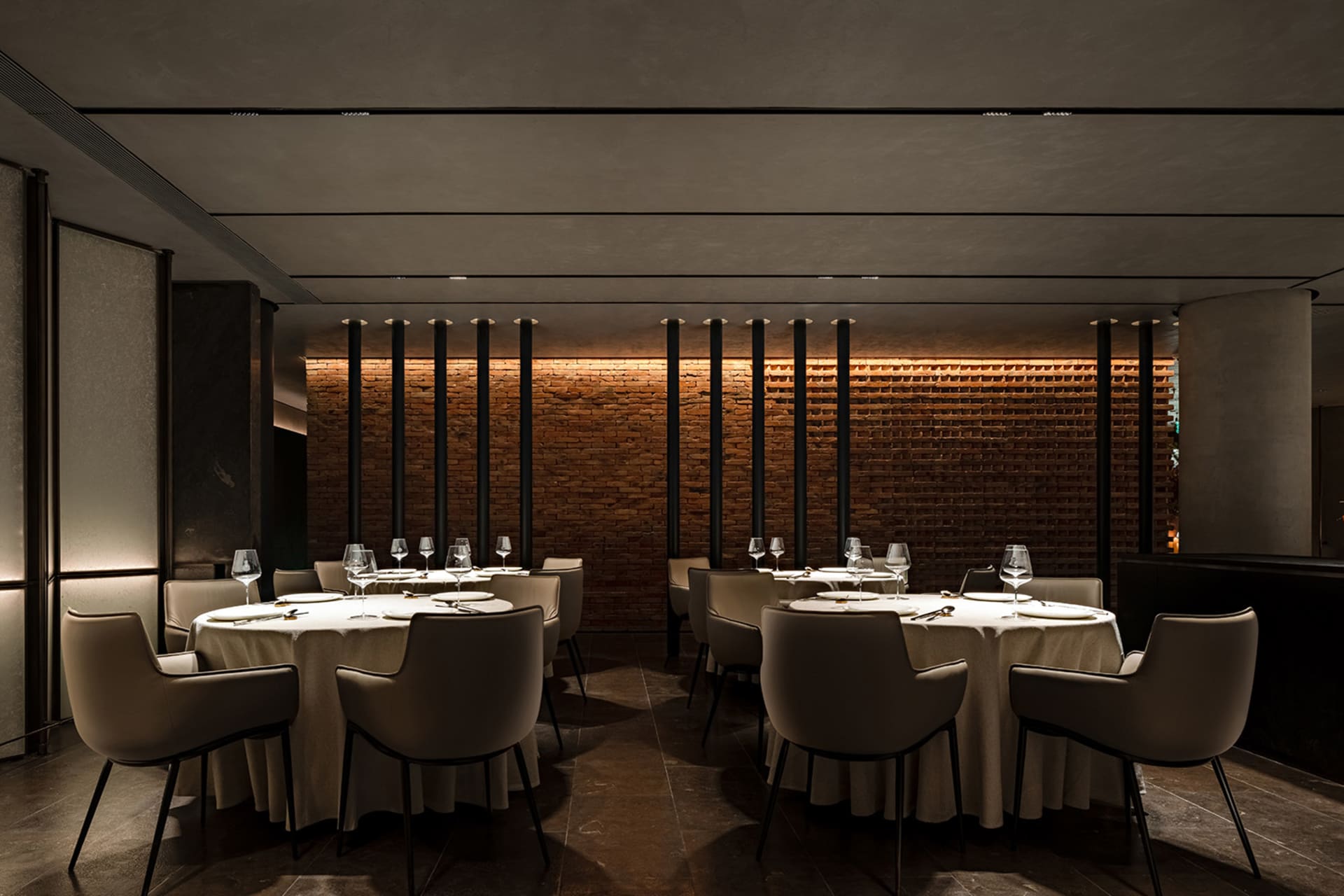 An industrial-style restaurant interior featuring brick walls.