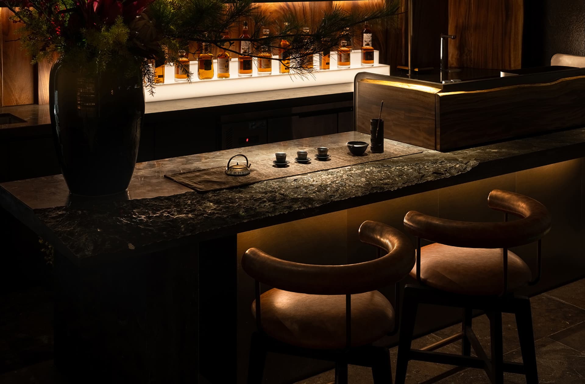 A modern bar with industrial design features made of stone.