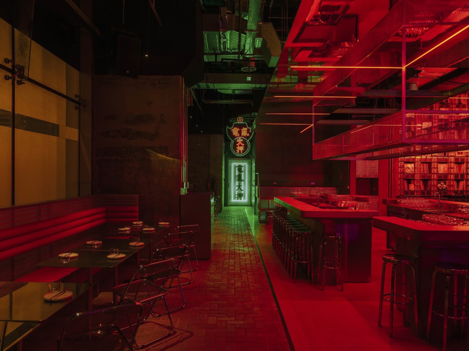 Modern restaurant bar interior with metallic accents and LED lighting.