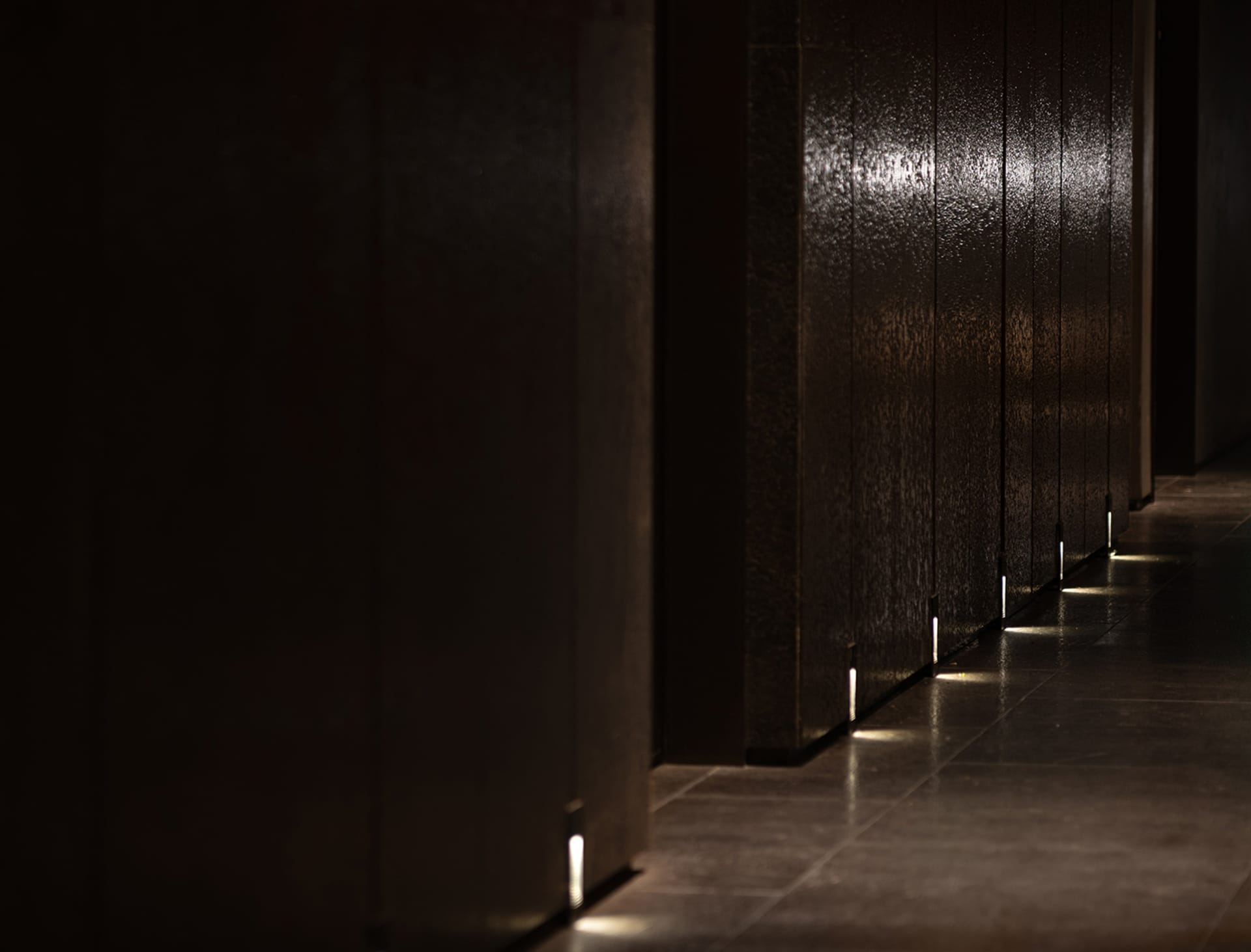 A minimalist hallway with a glass wall