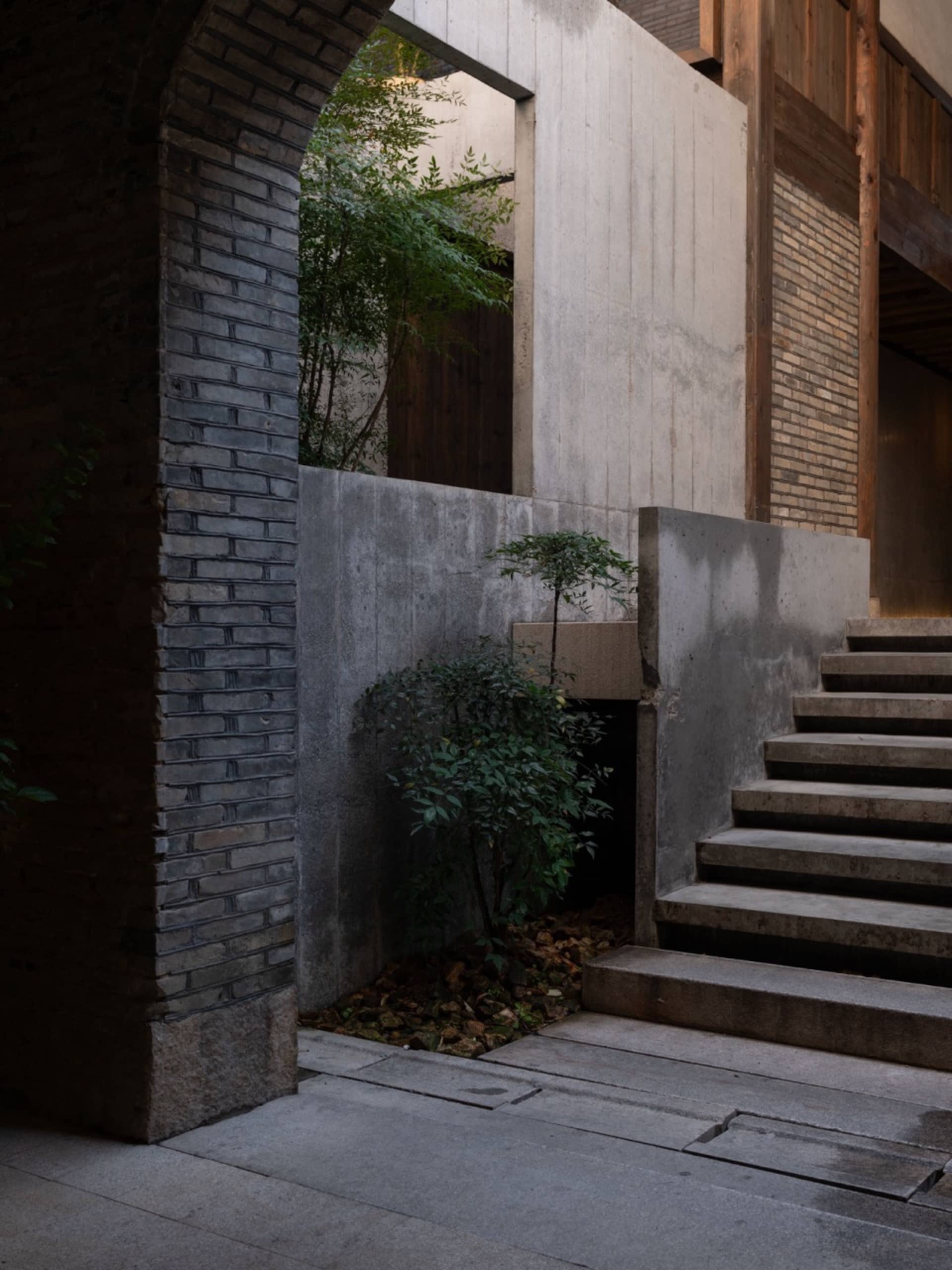 Modern interior design featuring brick and concrete materials.