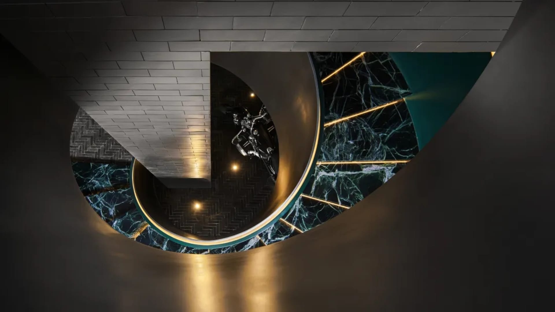 A modern interior featuring marble and stainless steel materials