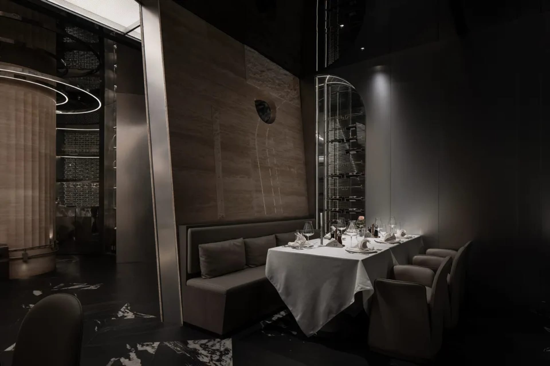 Modern restaurant with metal and wooden structures, glass walls, and elegant table setup