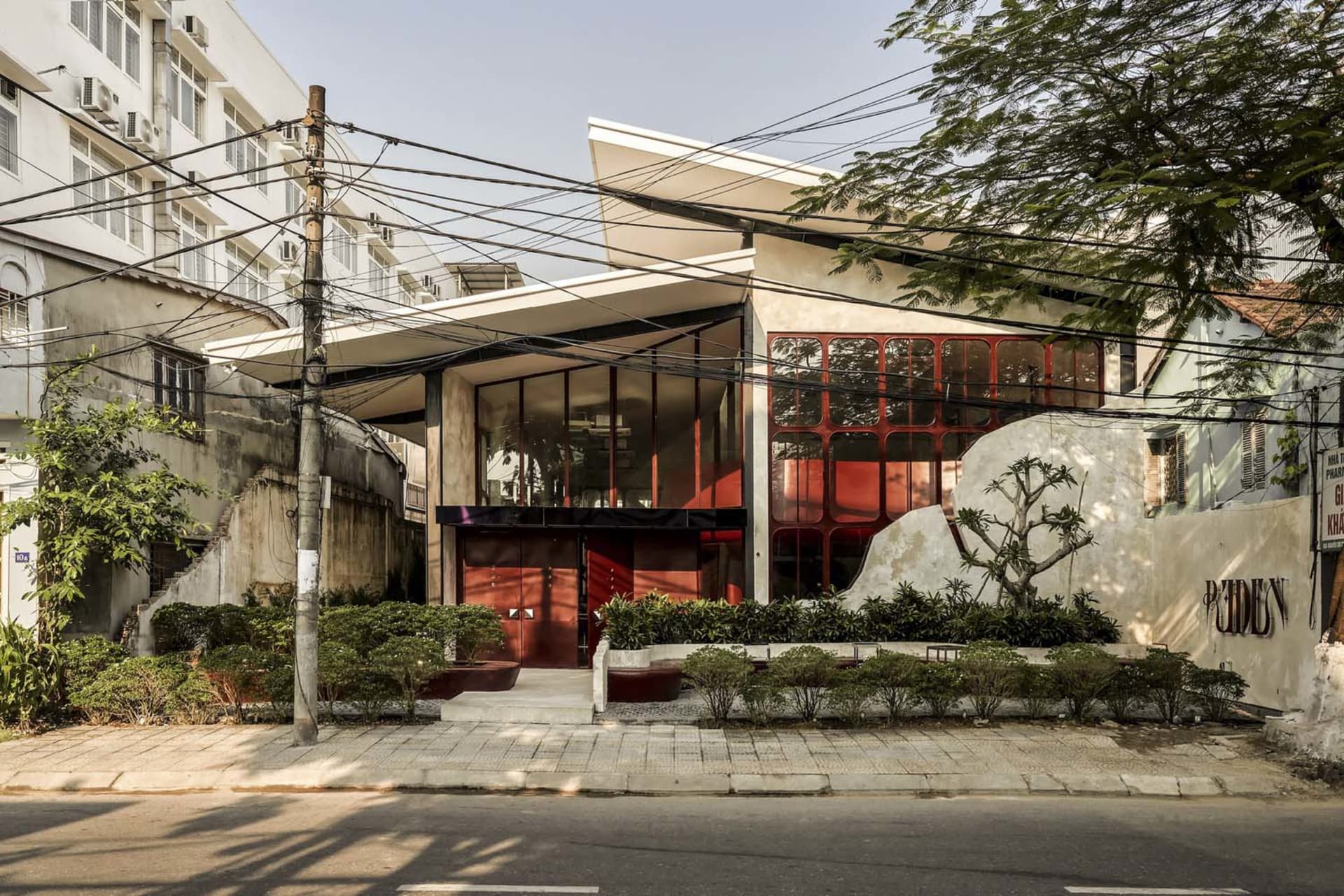 Modern building facade with concrete and glass materials.