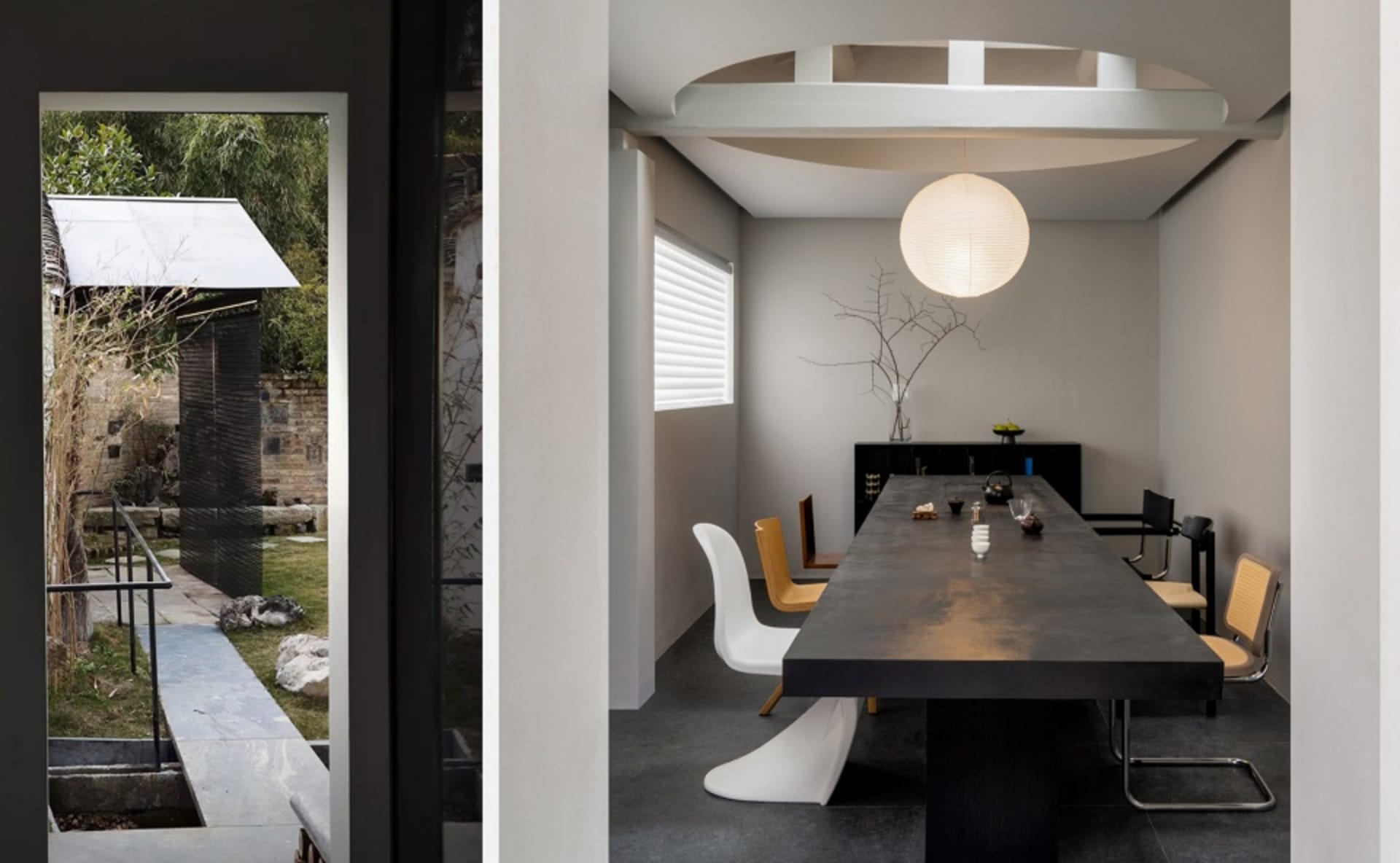 A minimalist dining room with a large concrete table and metal chairs.