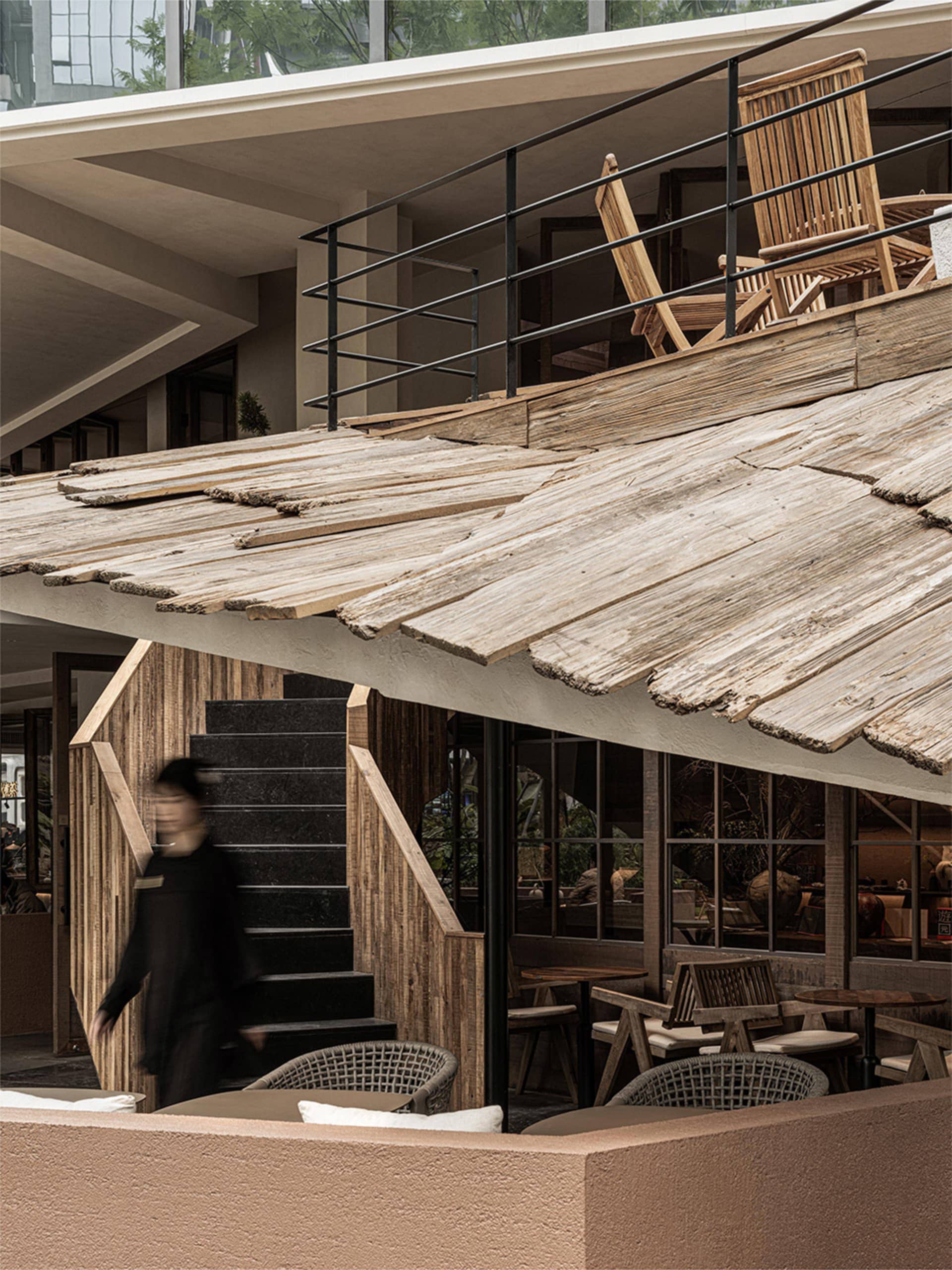 Industrial-style rooftop terrace featuring weathered wood materials.