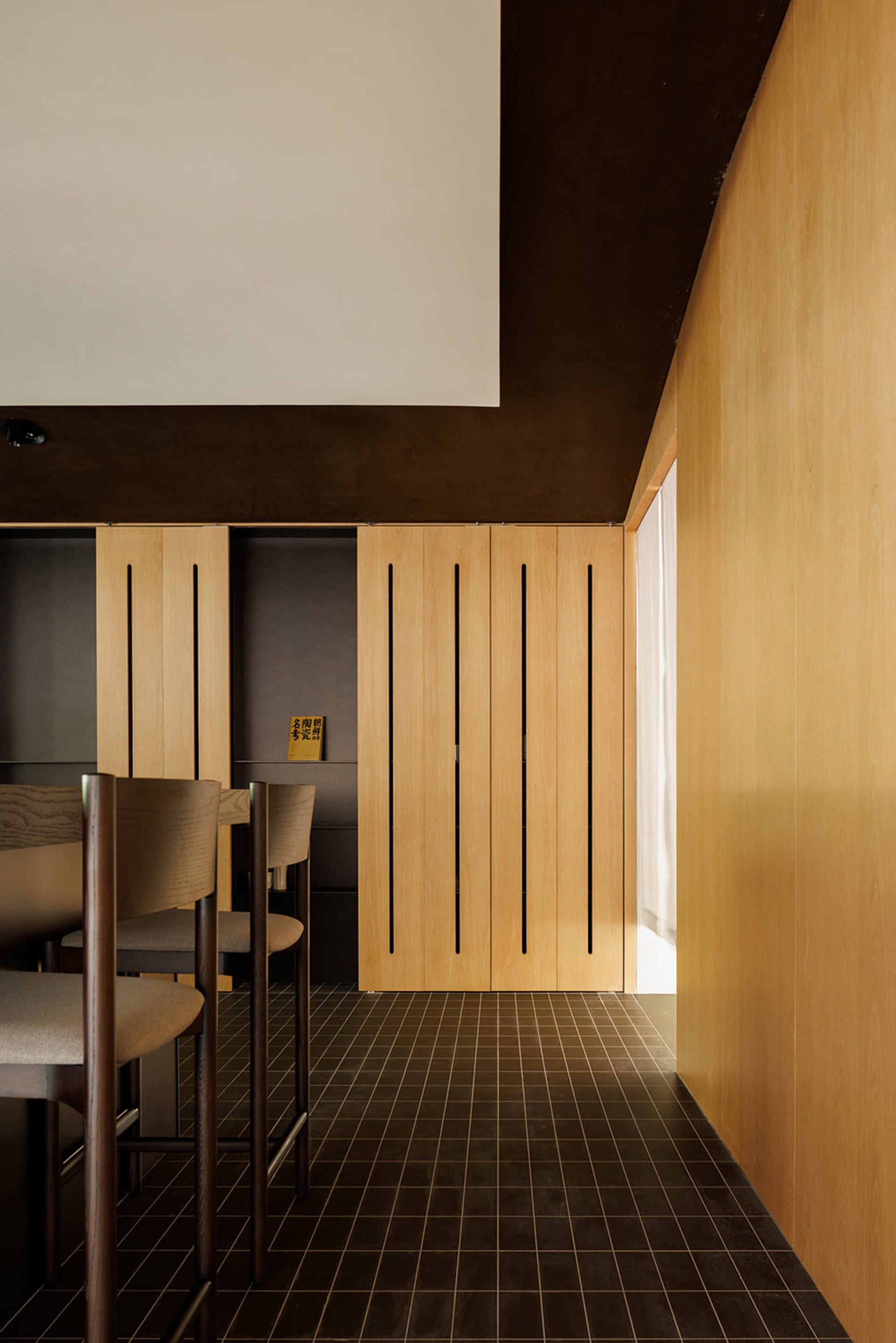 Modern residential space featuring wooden elements and minimalist design.