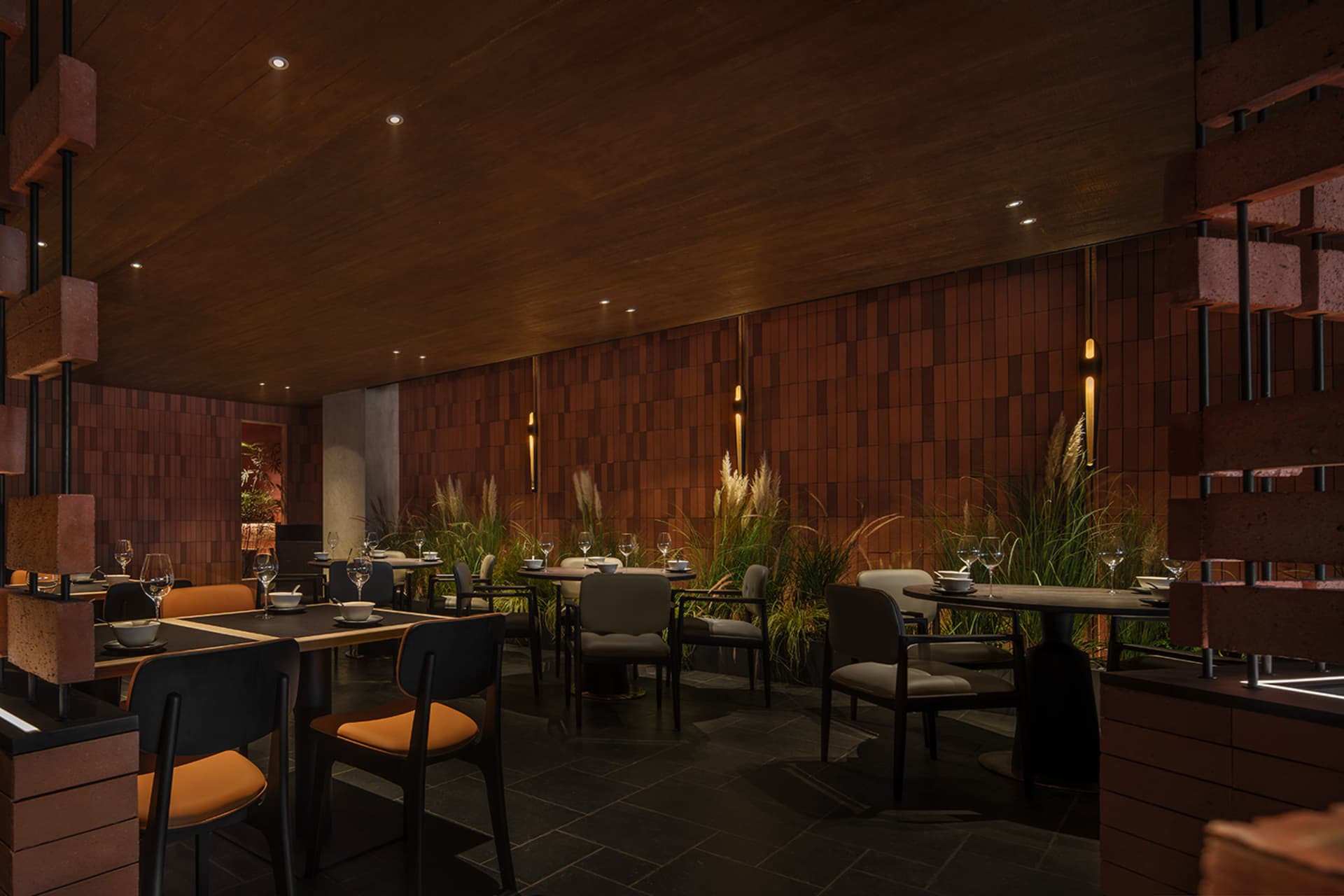 A modern restaurant interior with wooden walls, concrete finishes, and glass elements.