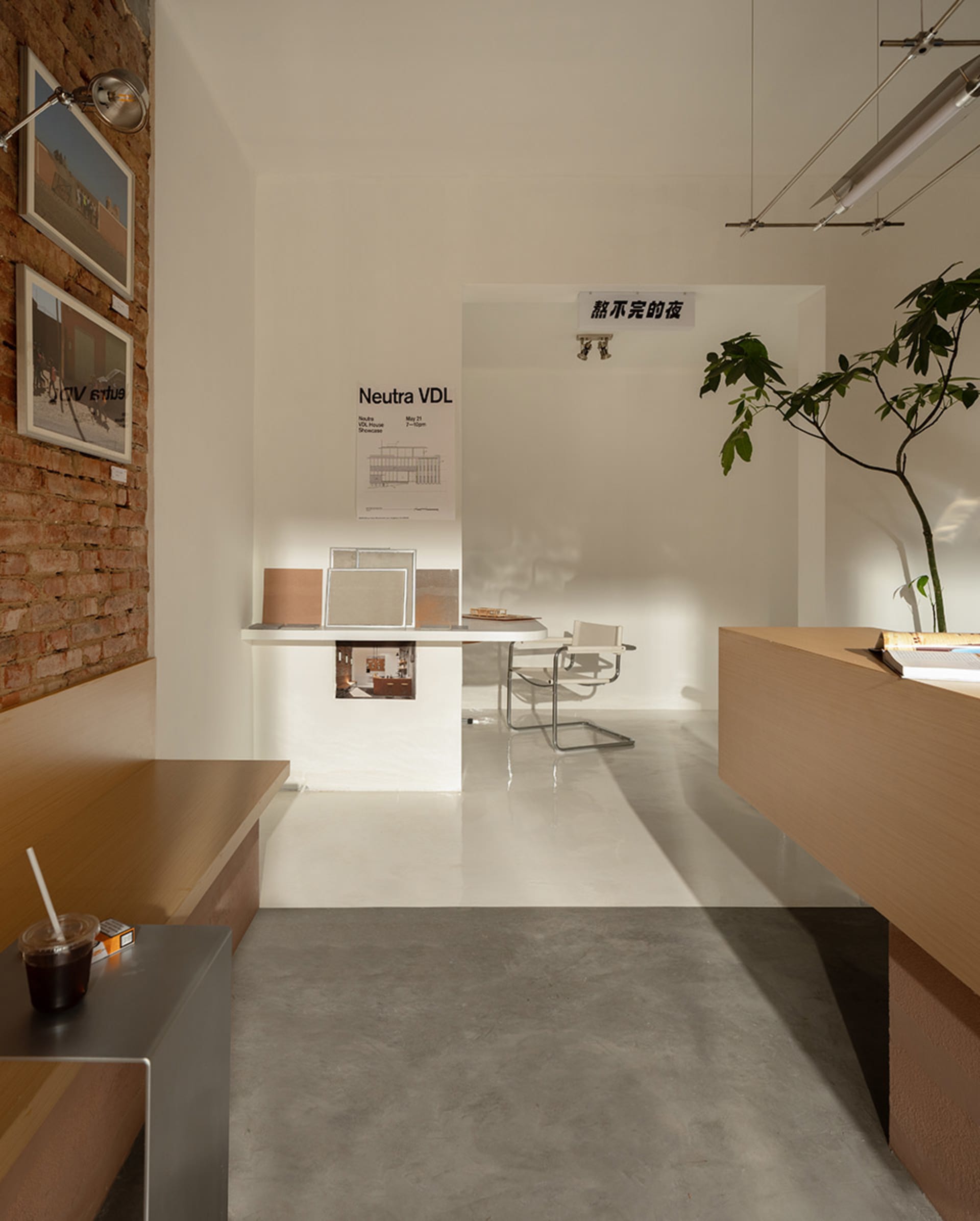 A minimalist, concrete-floored presentation hall