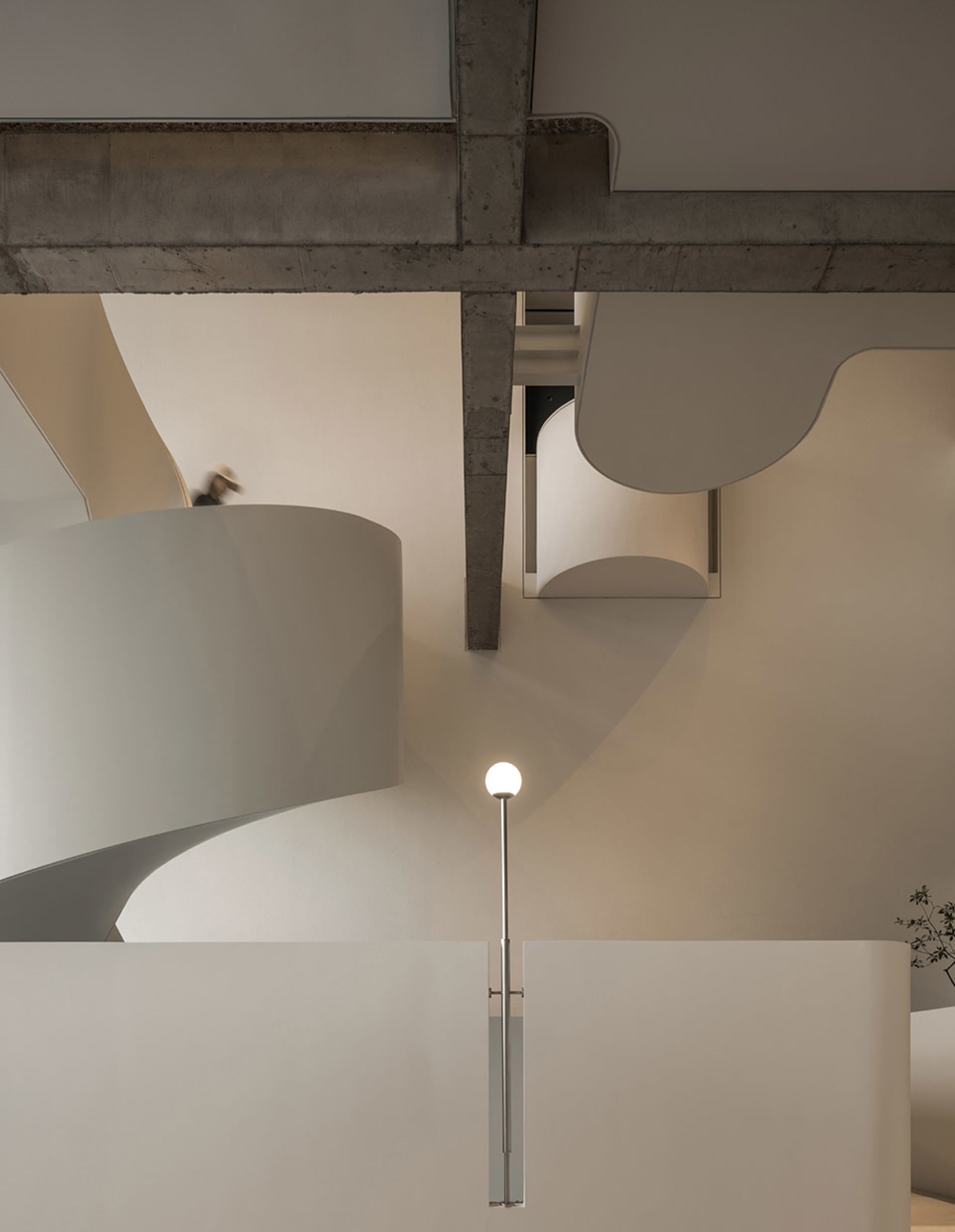 Contemporary residential interior with modern design, featuring concrete and metal materials and minimalist architectural ele