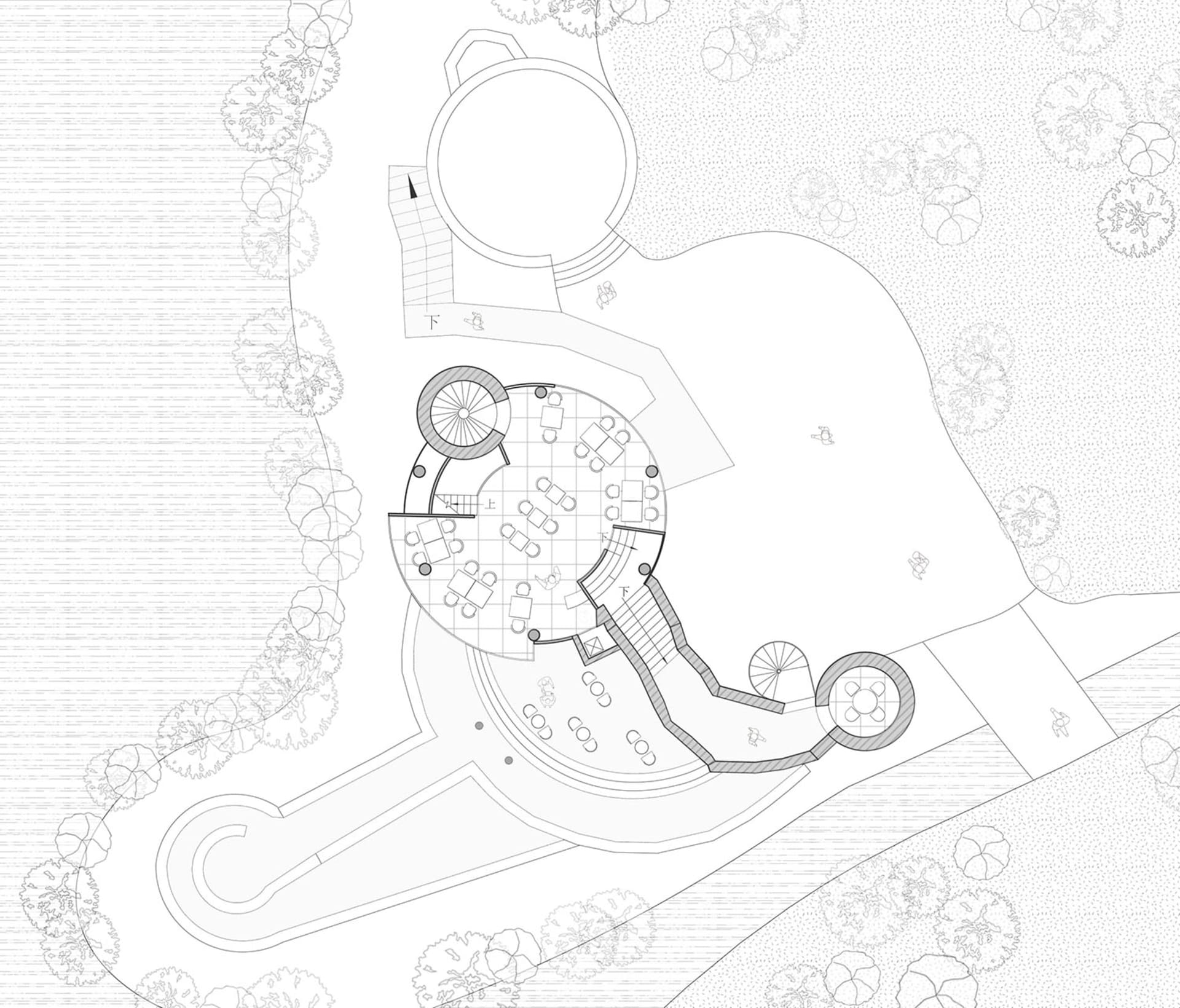 Modern architectural design with a circular layout, featuring open spaces and clean lines.