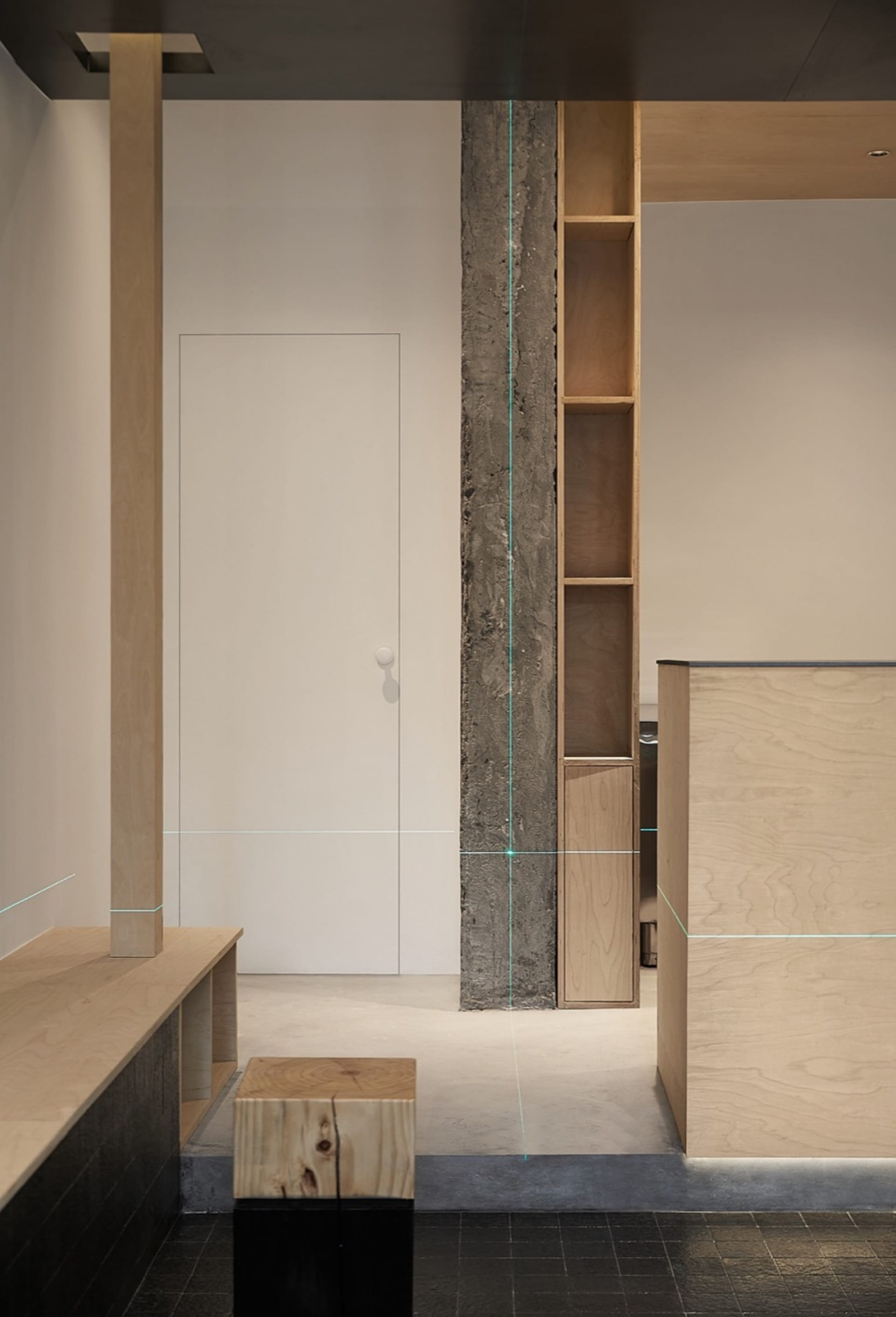 Modern minimalist office space with concrete elements and sleek, uncluttered design.