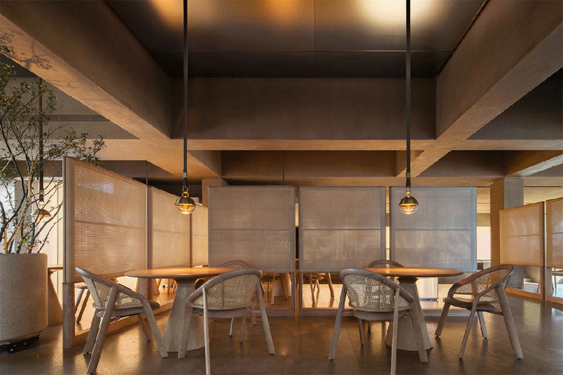 A modern restaurant interior featuring wooden furniture, with a focus on the clean lines and warm tones of the design.