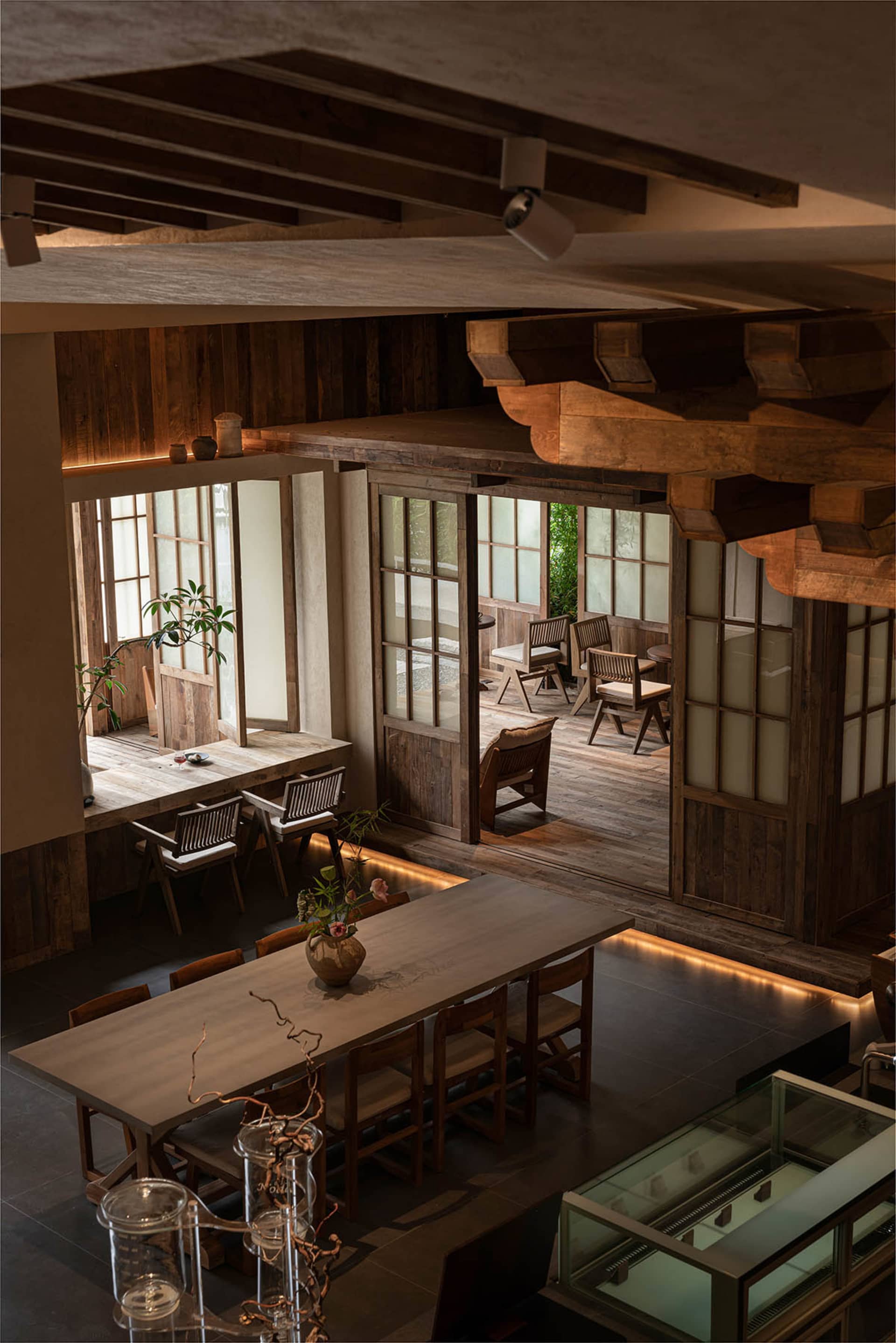 A cozy rustic cafe interior with wooden furniture and a warm, inviting atmosphere.